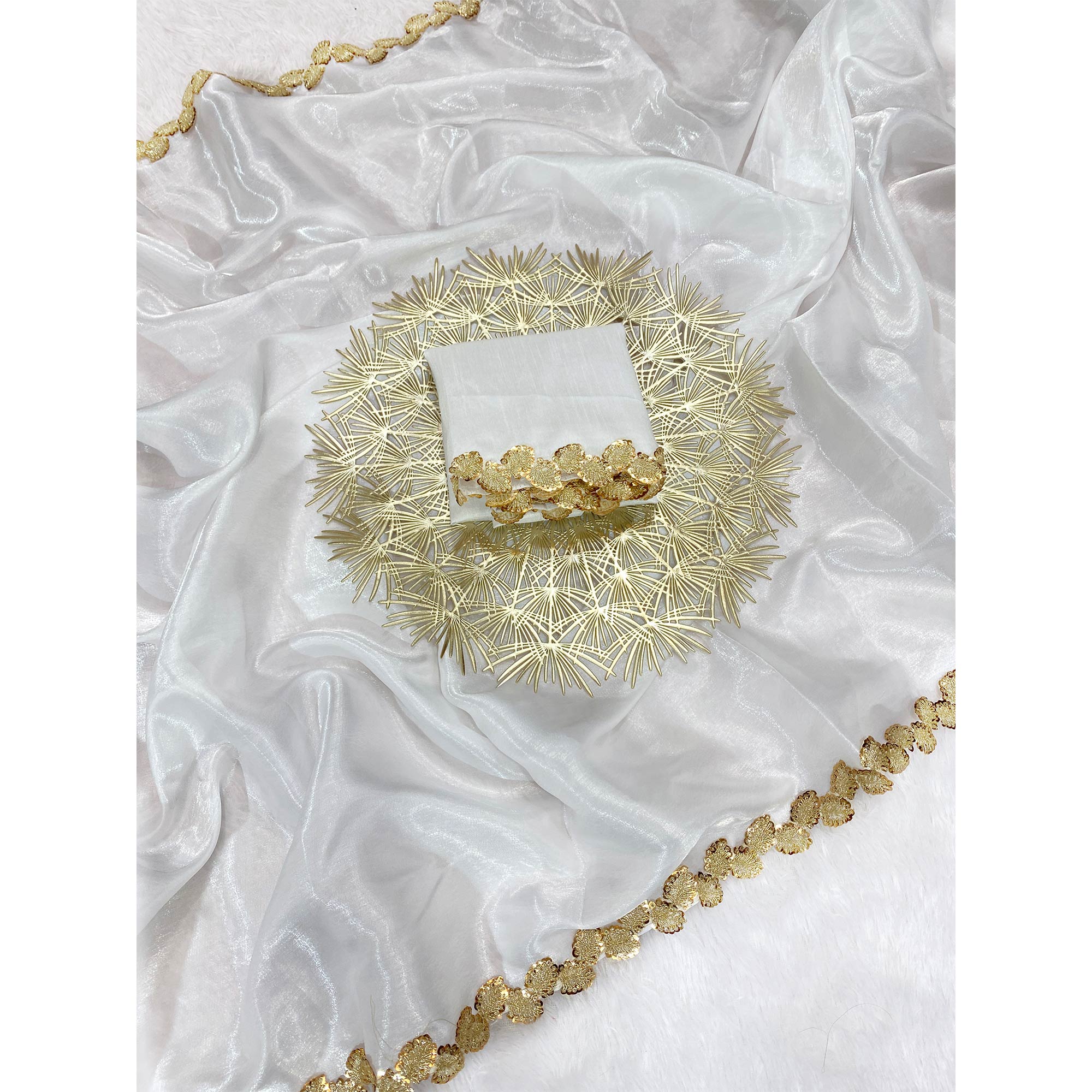 White Tissue Saree Featuring Solid Finish and Delicate Lace Work by Jimmy Choo Style