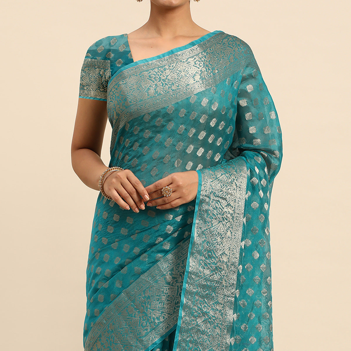 Turquoise Woven Organza Silk Saree With Tassels