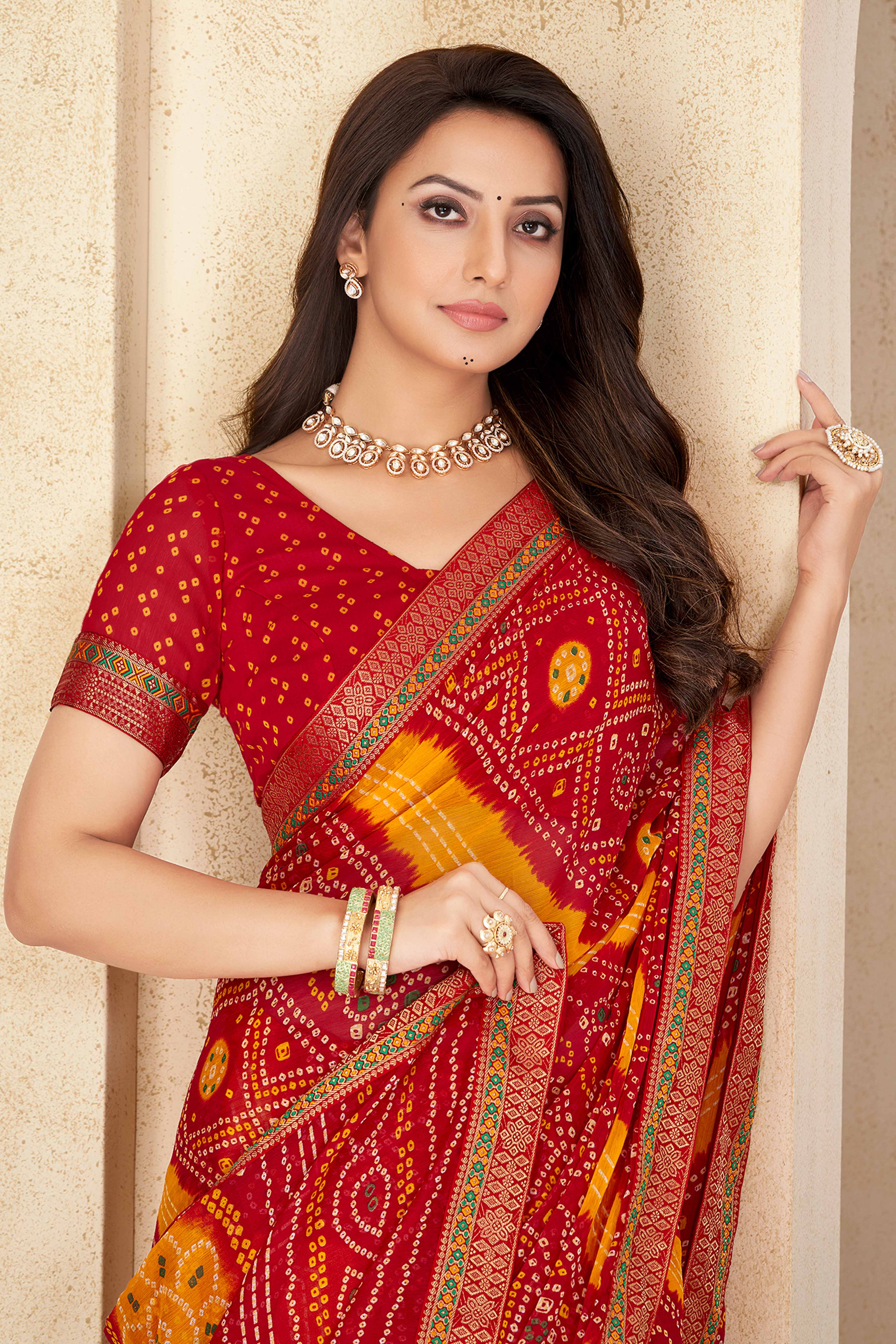 Red & Mustard Bandhani Printed Chiffon Saree Enhanced with Delicate Lace Border Work