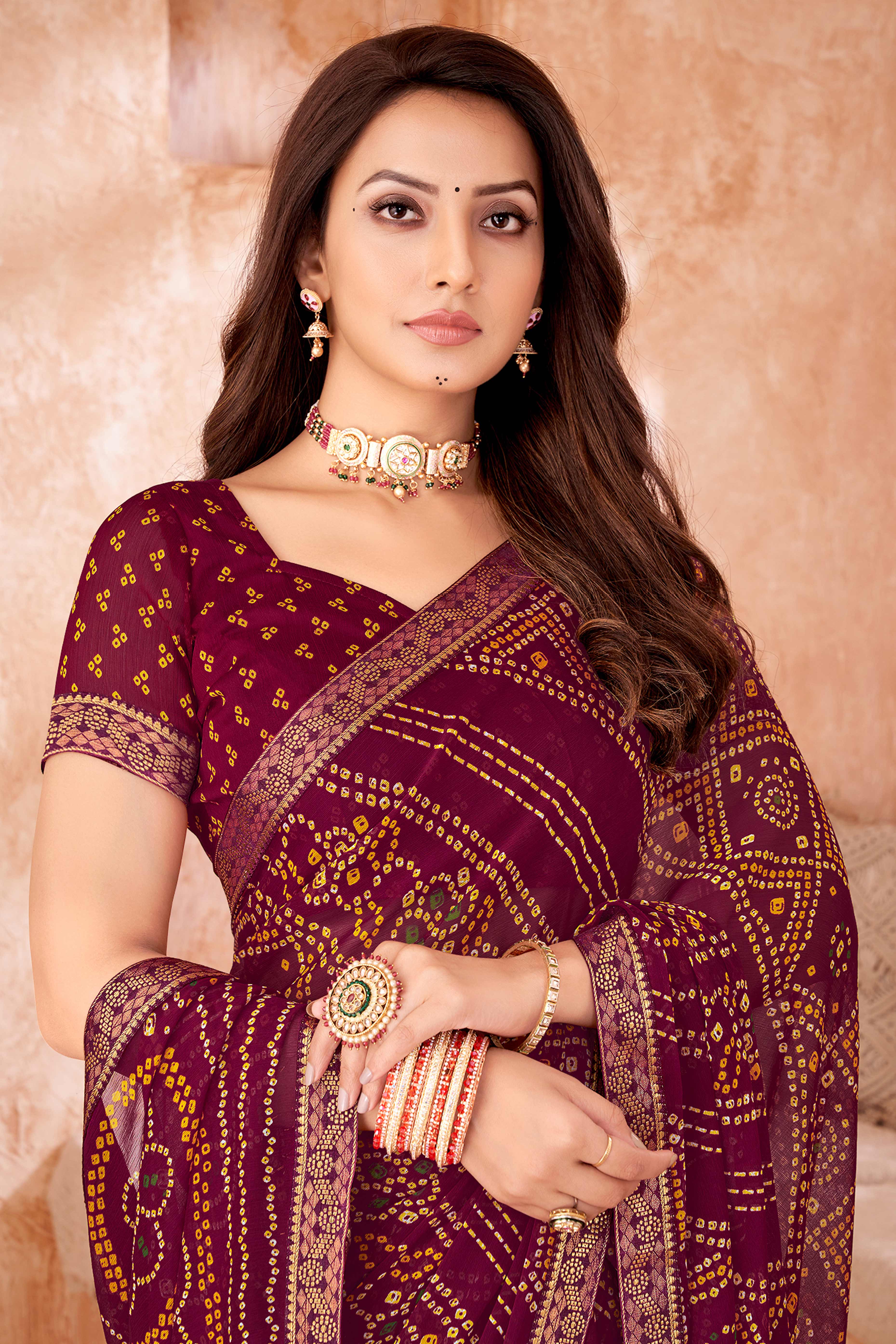 Maroon Chiffon Saree Featuring Traditional Bandhani Prints & A Graceful Lace Edge