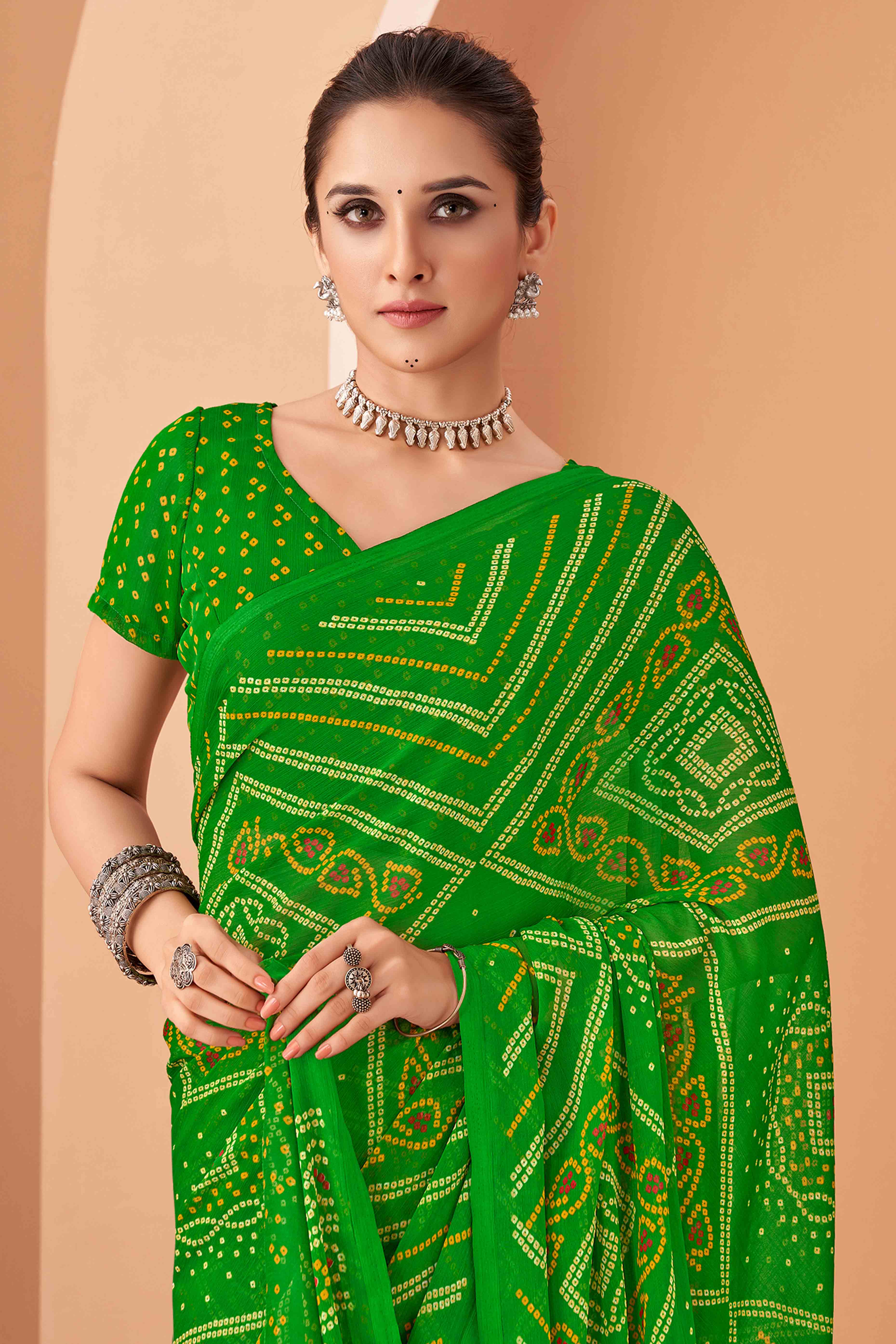 Green Bandhani Printed Chiffon Saree Accented With Intricate Lace Border Work