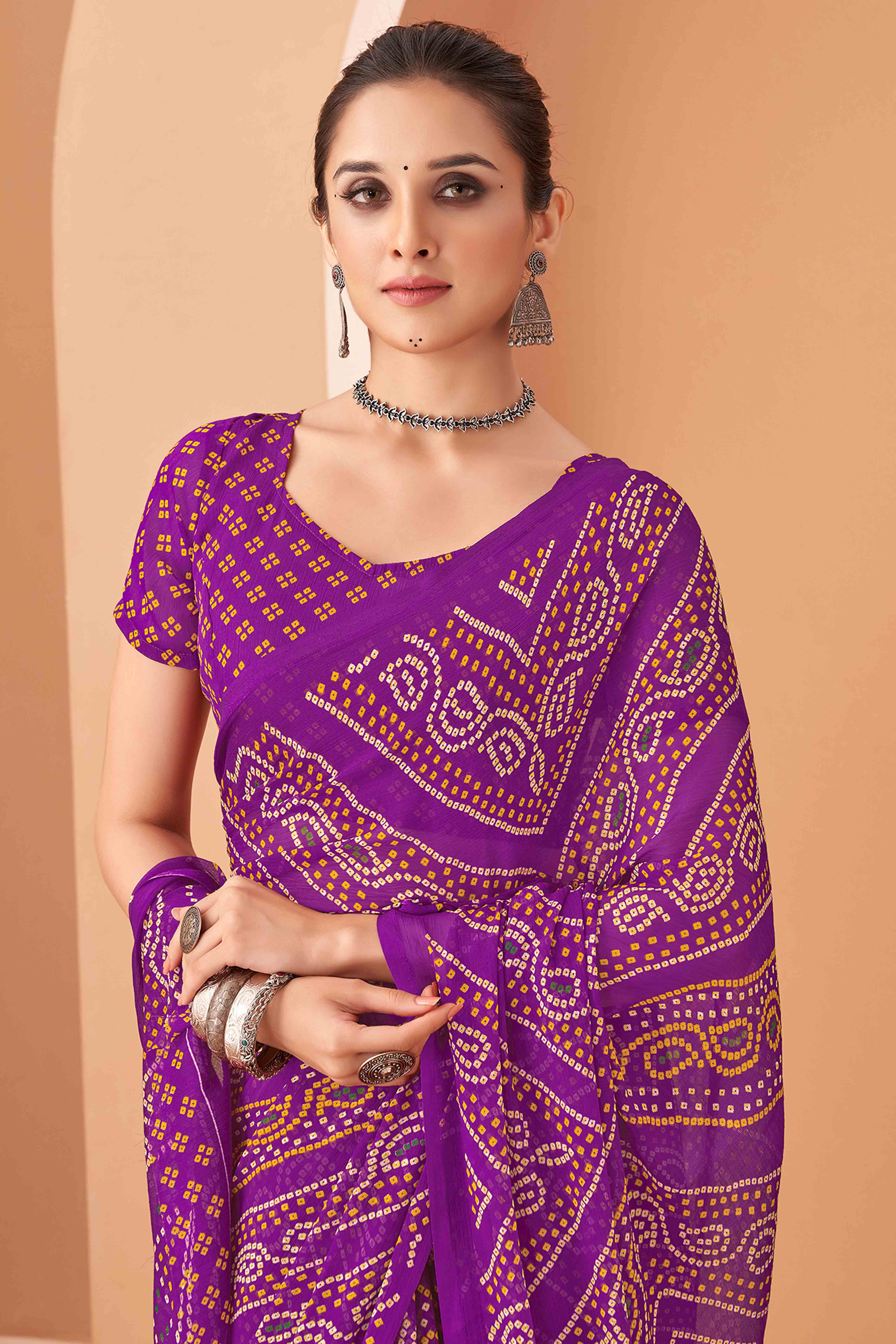 Purple Bandhani Printed Chiffon Saree Accented With Intricate Lace Border Work