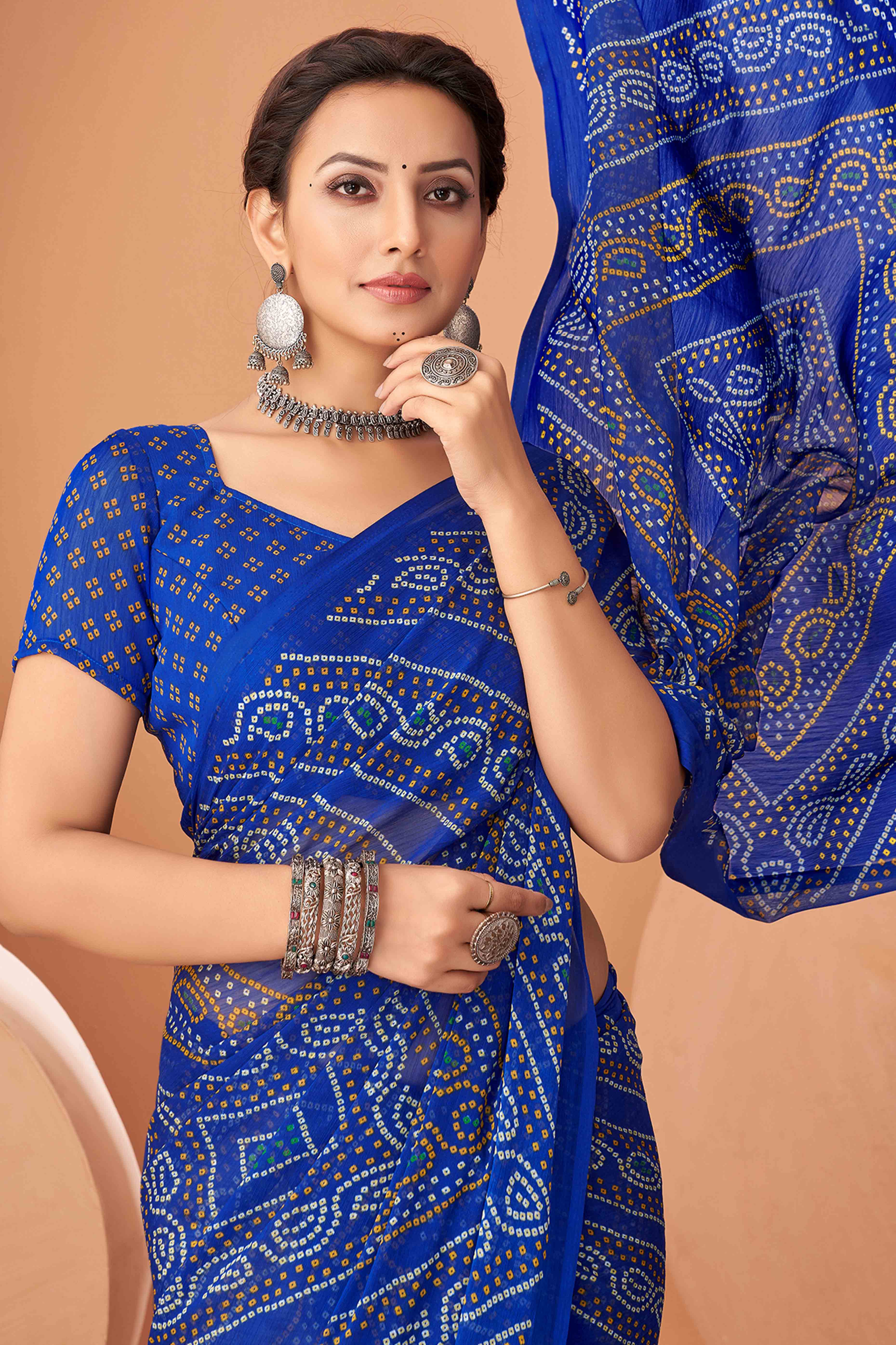 Blue Bandhani Printed Chiffon Saree Accented With Intricate Lace Border Work