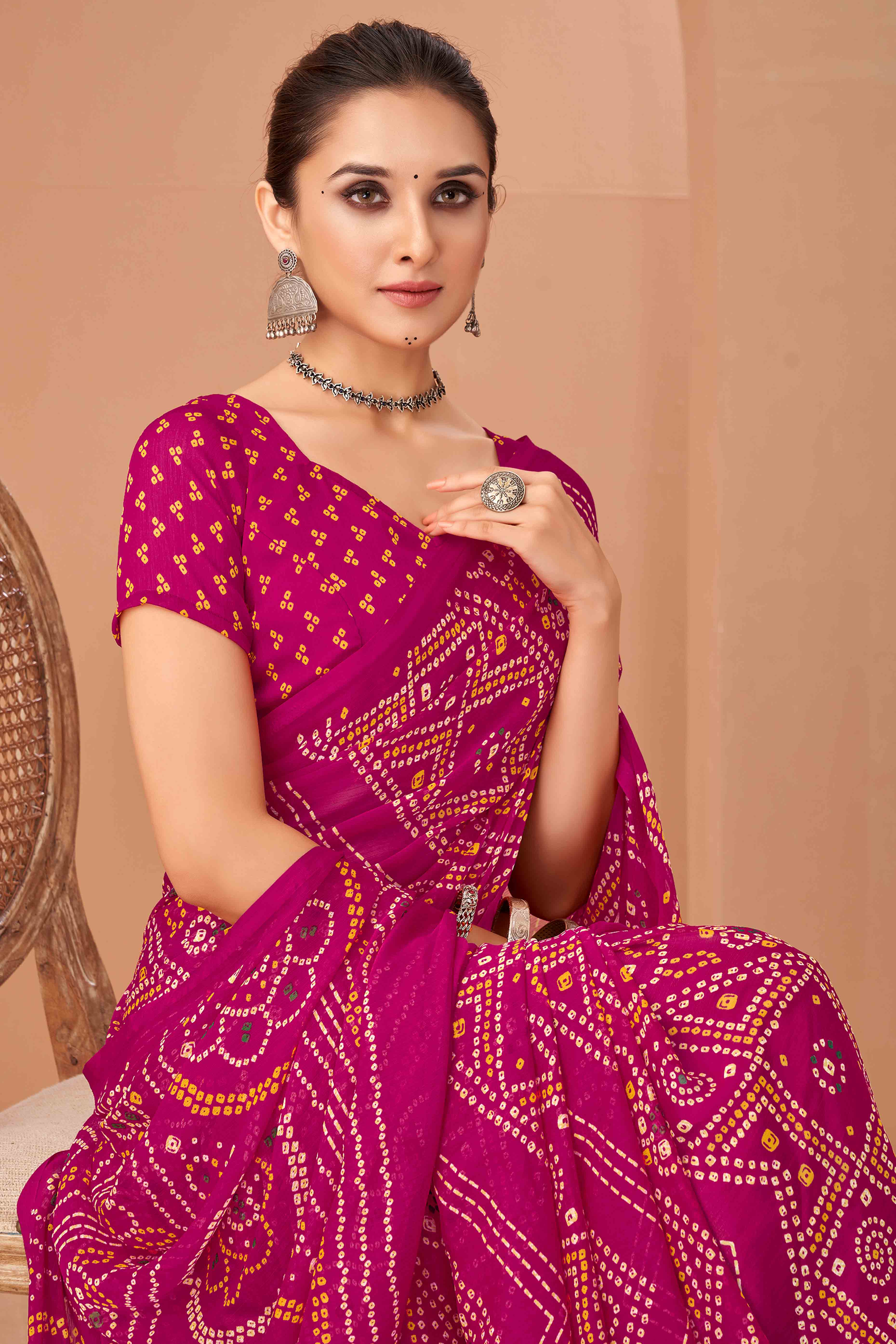 Magenta Bandhani Printed Chiffon Saree Accented With Intricate Lace Border Work