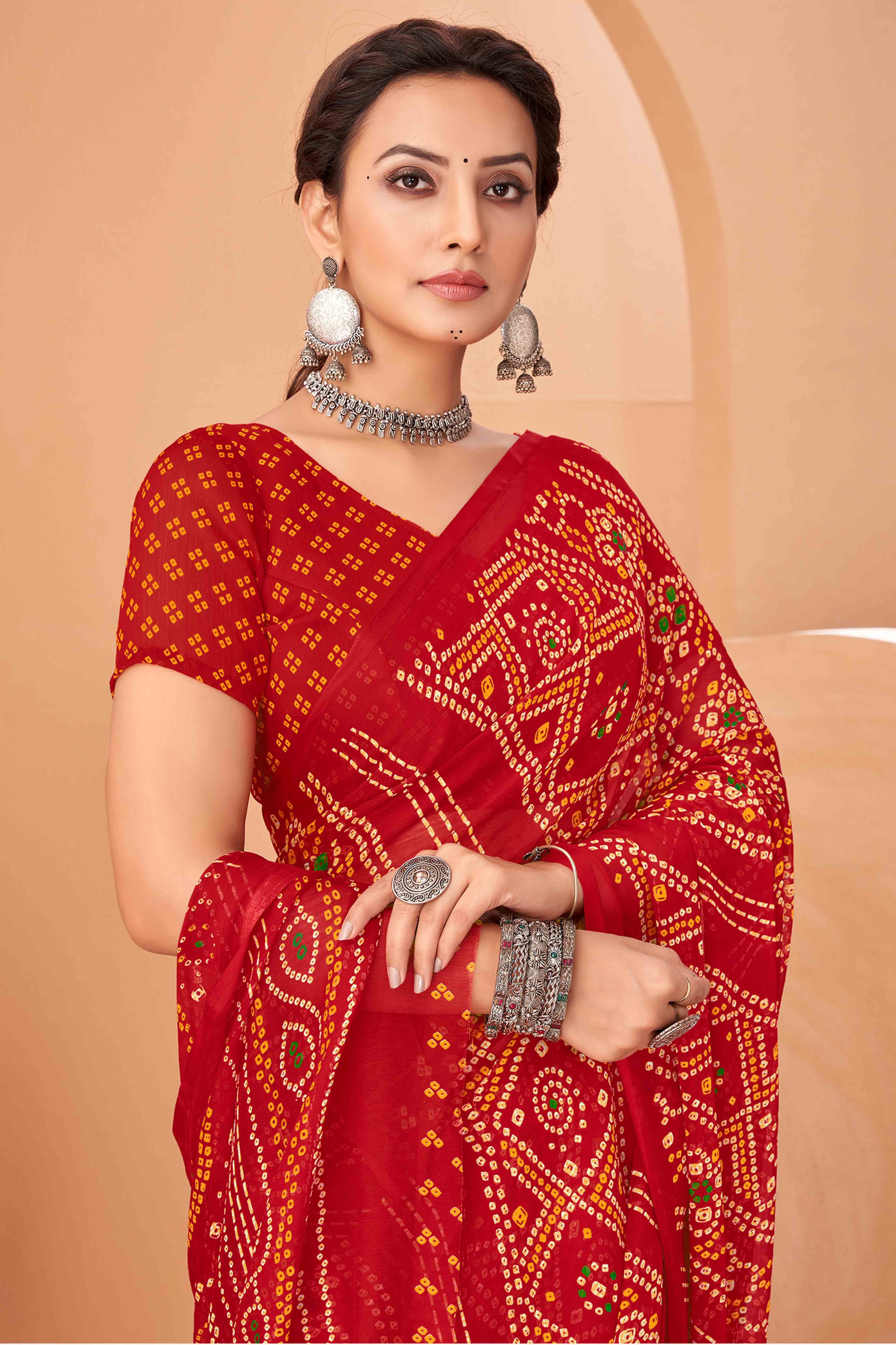 Red Bandhani Printed Chiffon Saree Accented With Intricate Lace Border Work