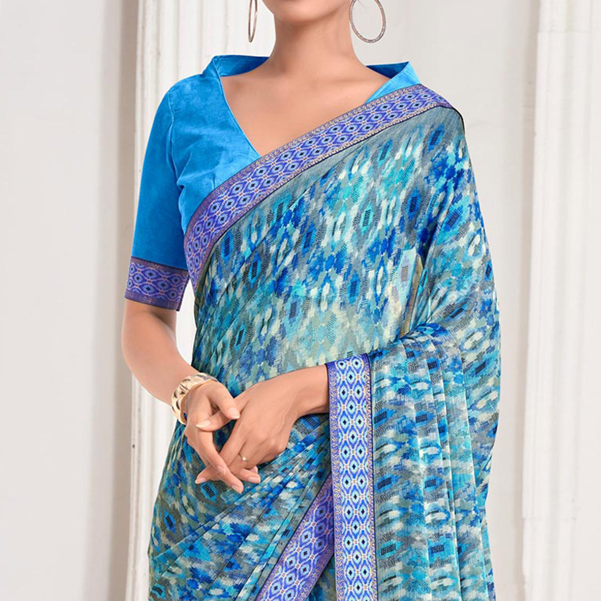 Blue Printed Chiffon Saree With Lace Border