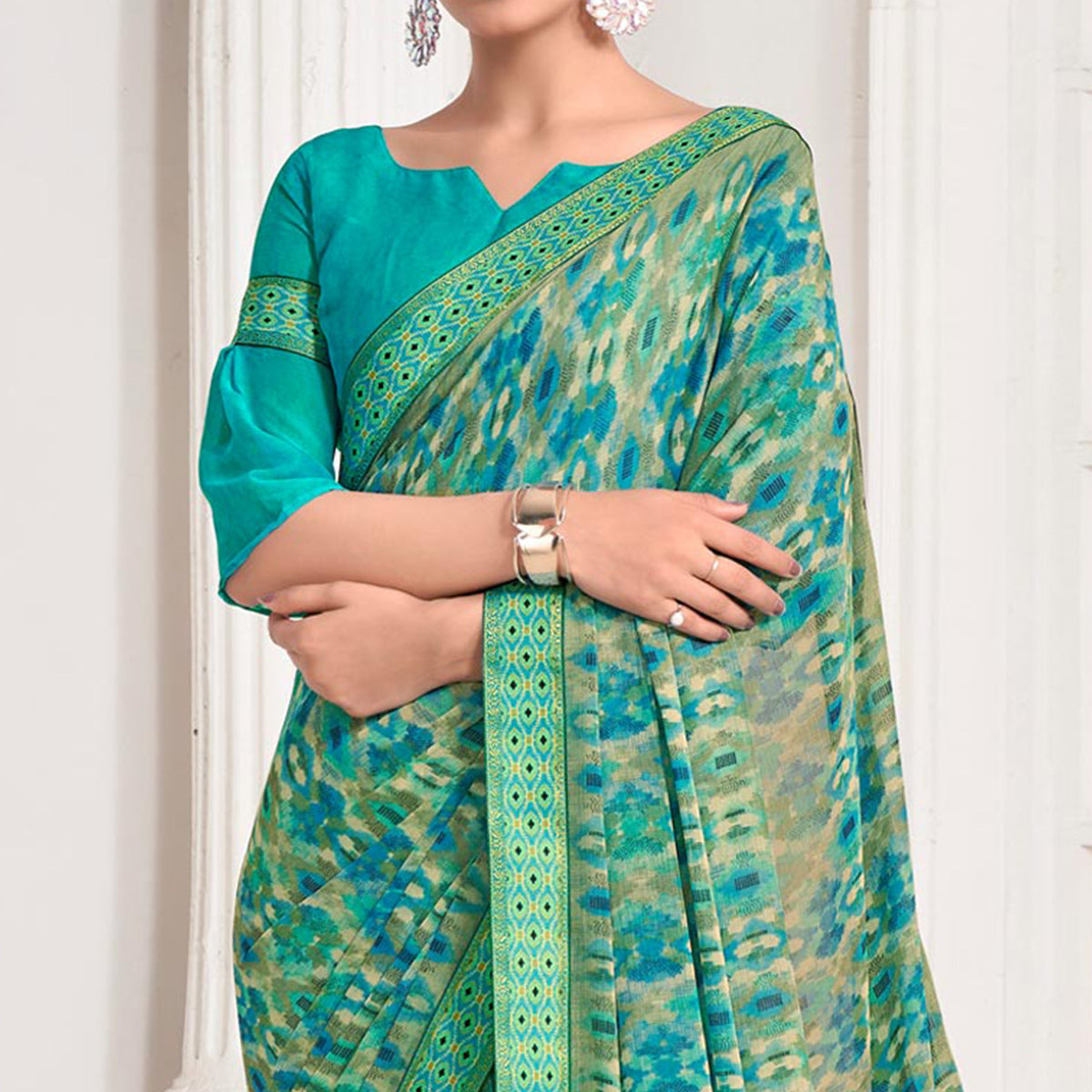 Turquoise Printed Chiffon Saree With Lace Border