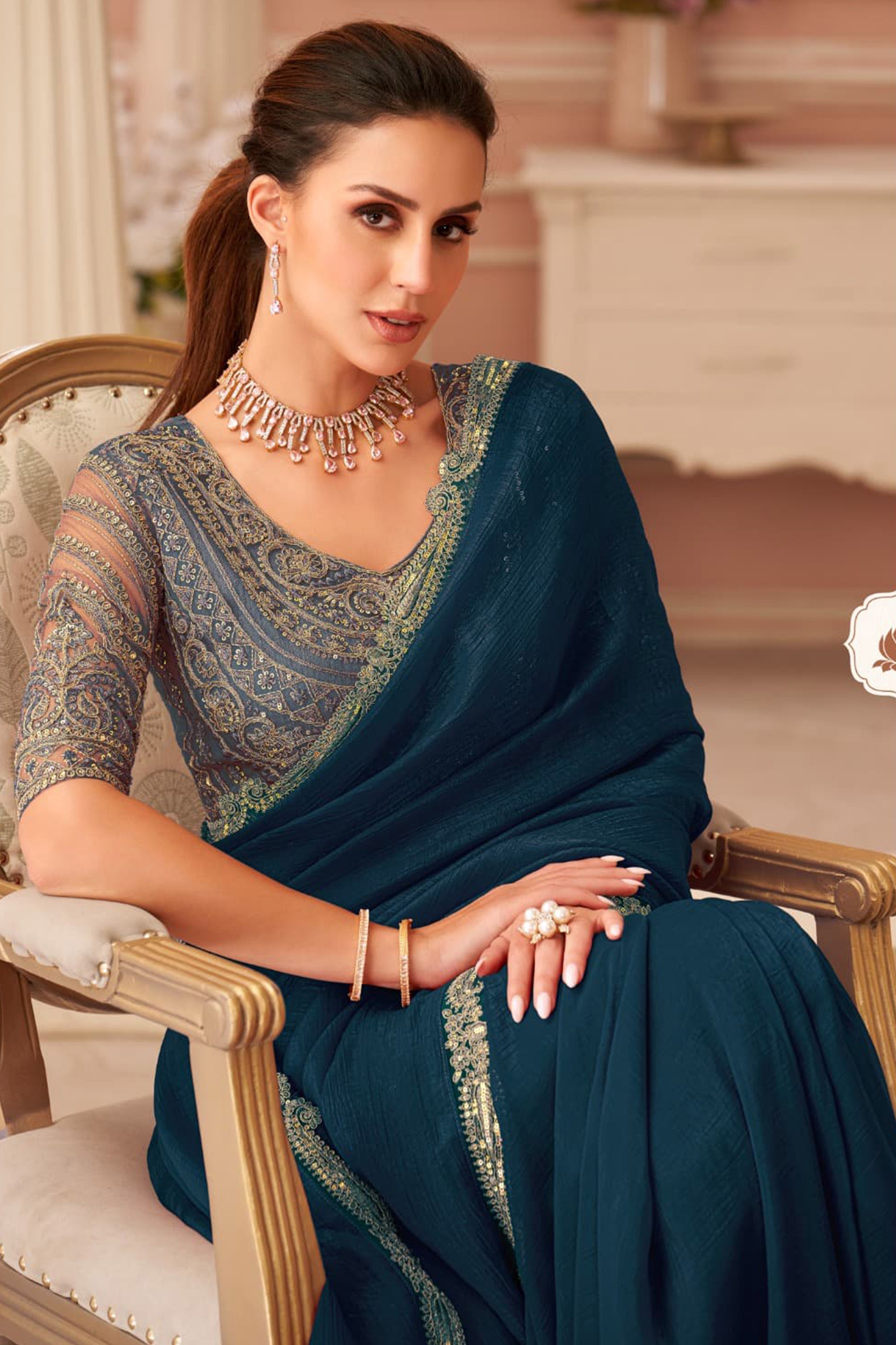 Graceful Teal Georgette Saree with Intricate Sequin Embroidery Detailing