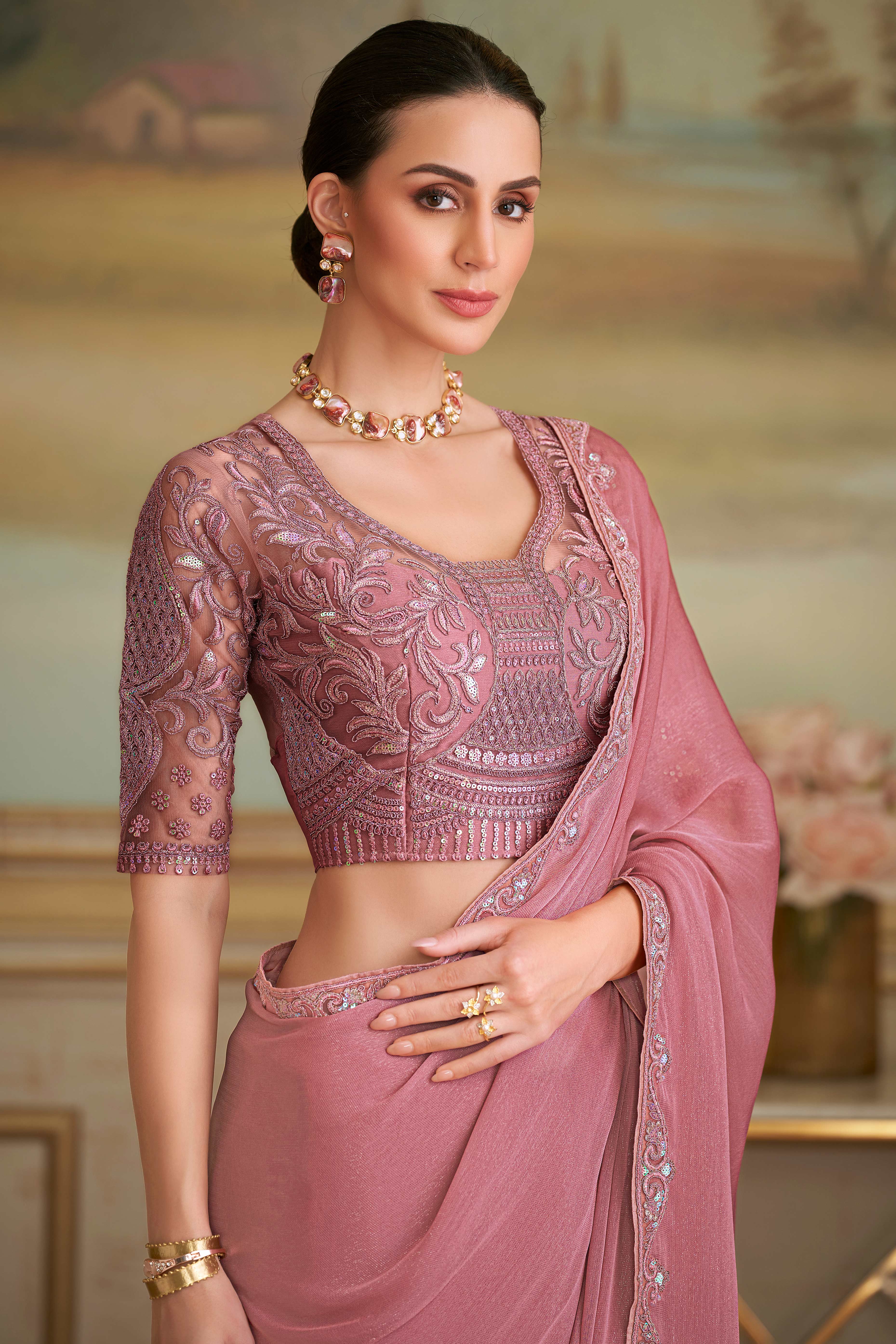Graceful Onion Pink Sparkle Georgette Saree Adorned With Floral Sequins Embroidered Lace Border