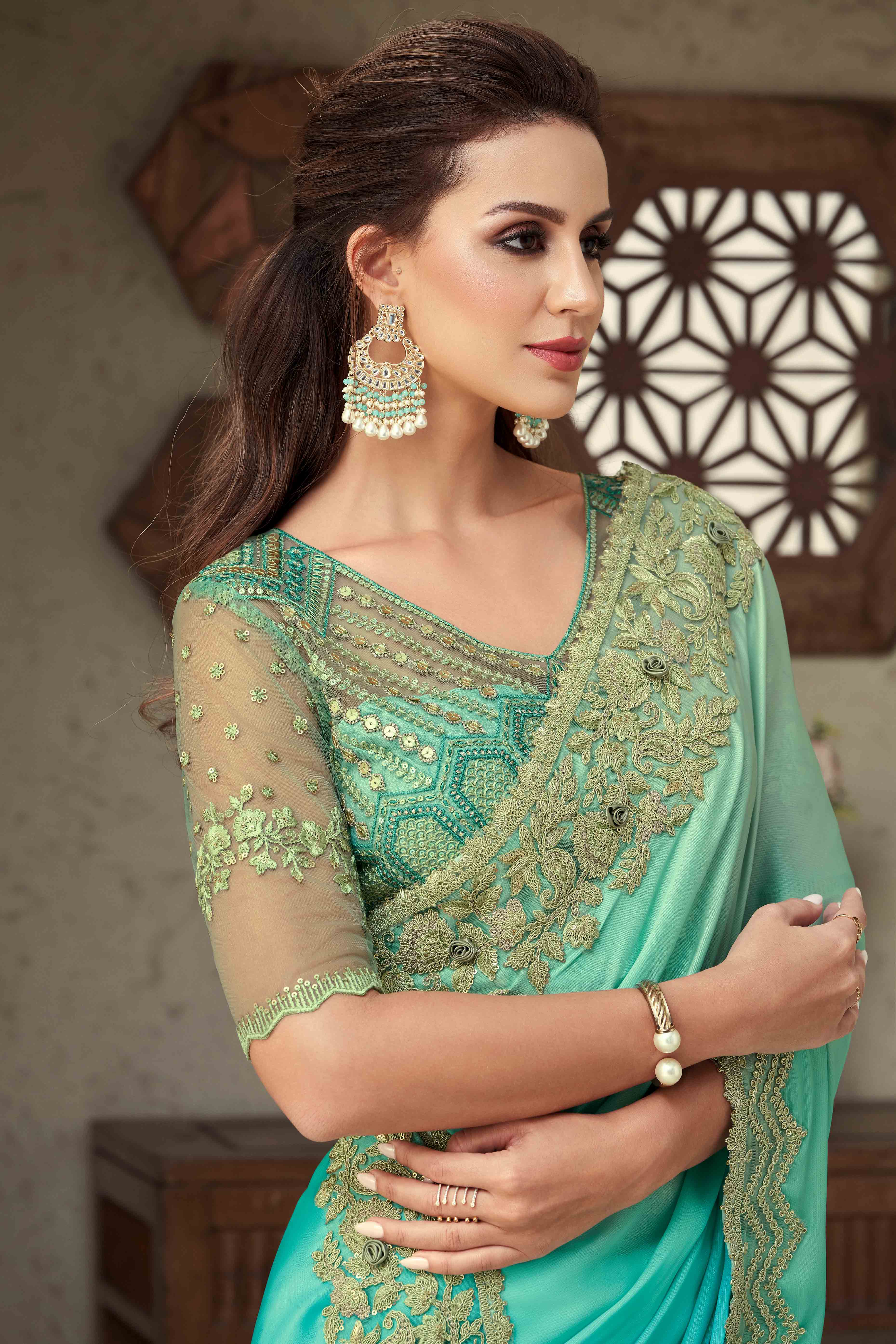 Turquoise Floral Sequins Embroidered Georgette Saree