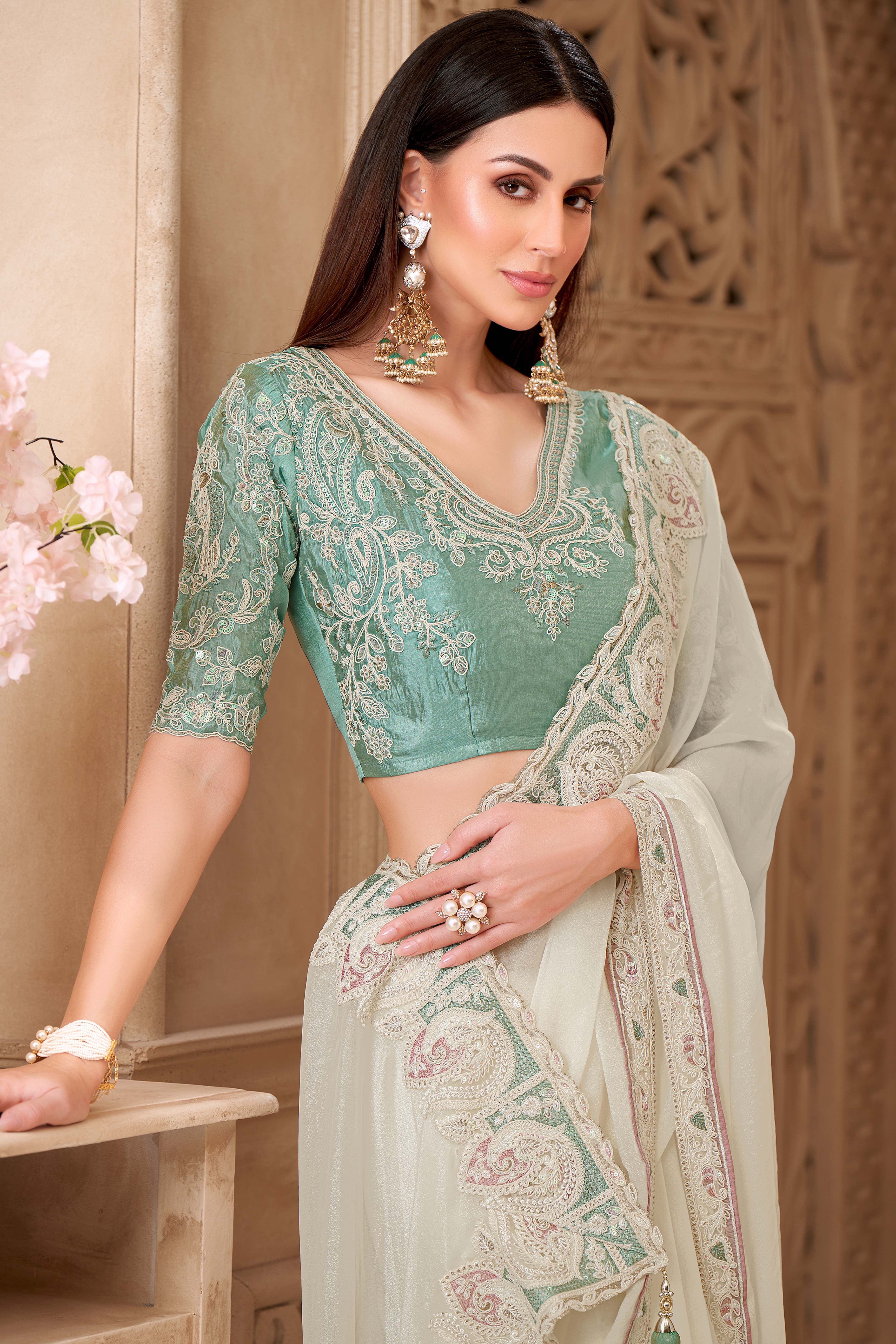 Shimmering Cream Georgette Saree with Graceful Thread Embellishment and Sequins