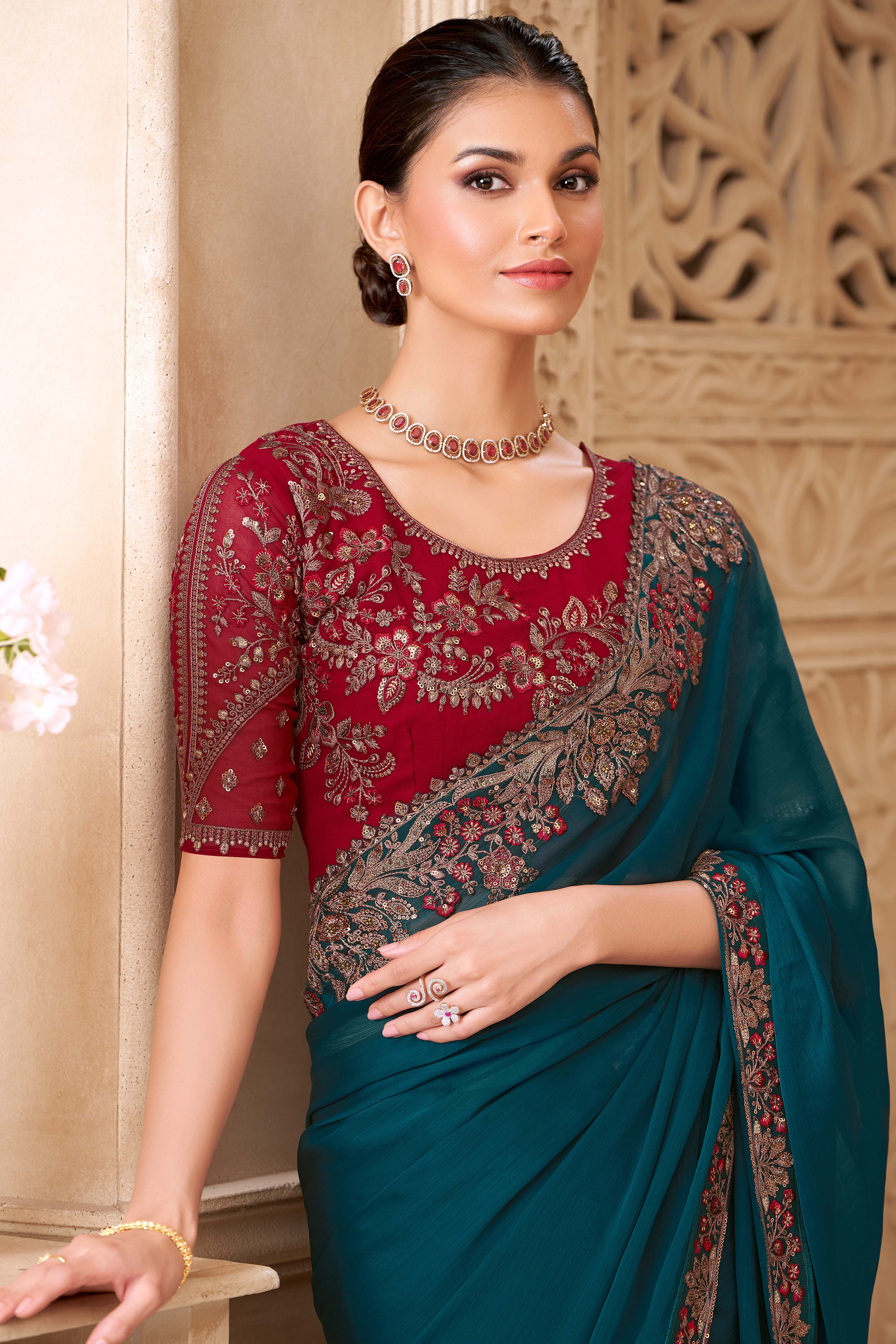 Shimmering Teal Georgette Saree with Graceful Thread Embellishment and Sequins