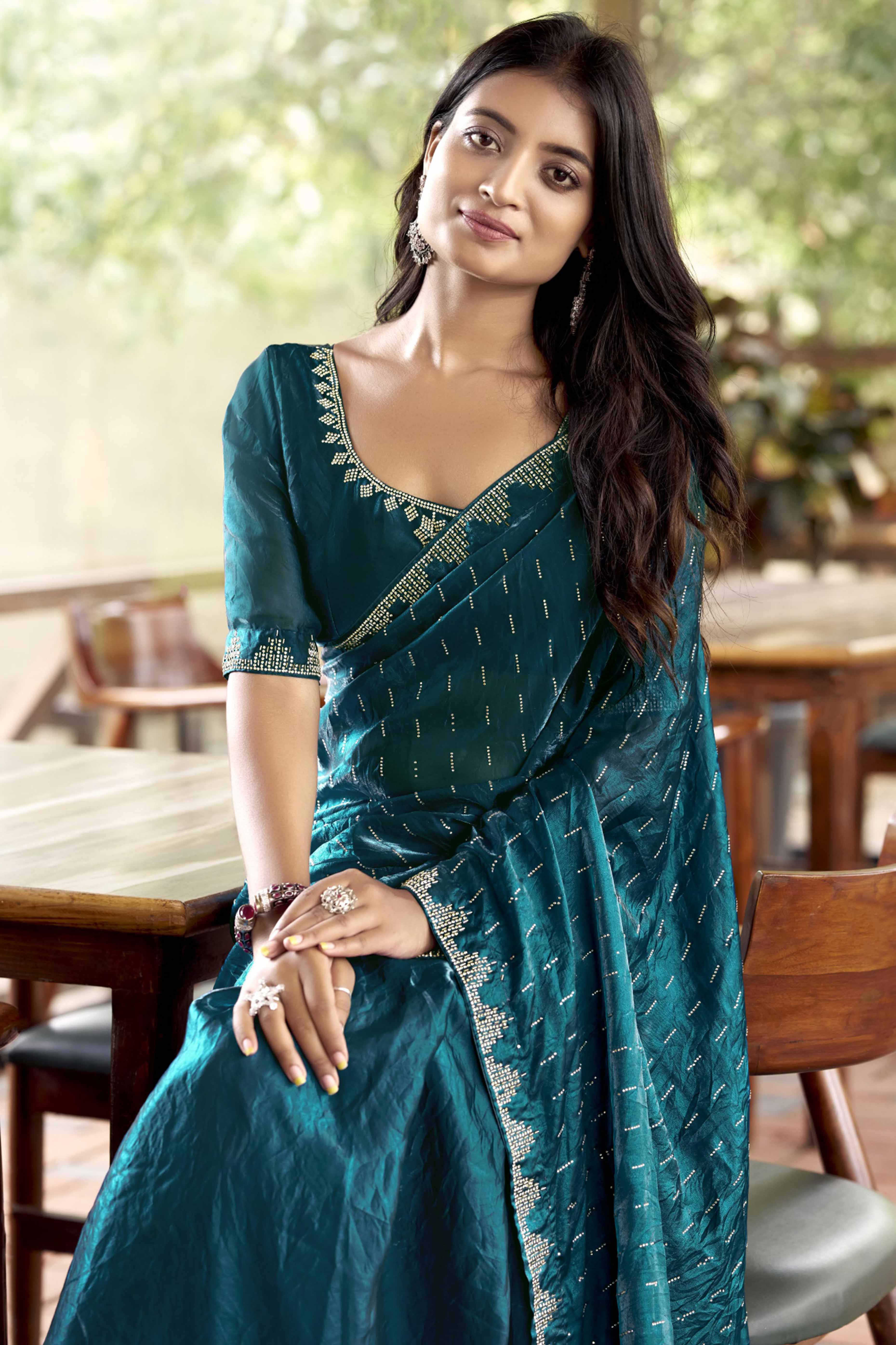 Graceful Teal Nylon Partywear Saree Adorned with Exquisite Stone Work