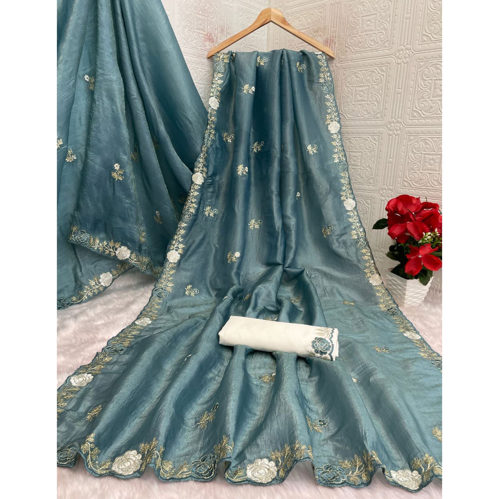 Blue Lightweight Georgette Crush Saree Adorned with Delicate Floral Embroidery