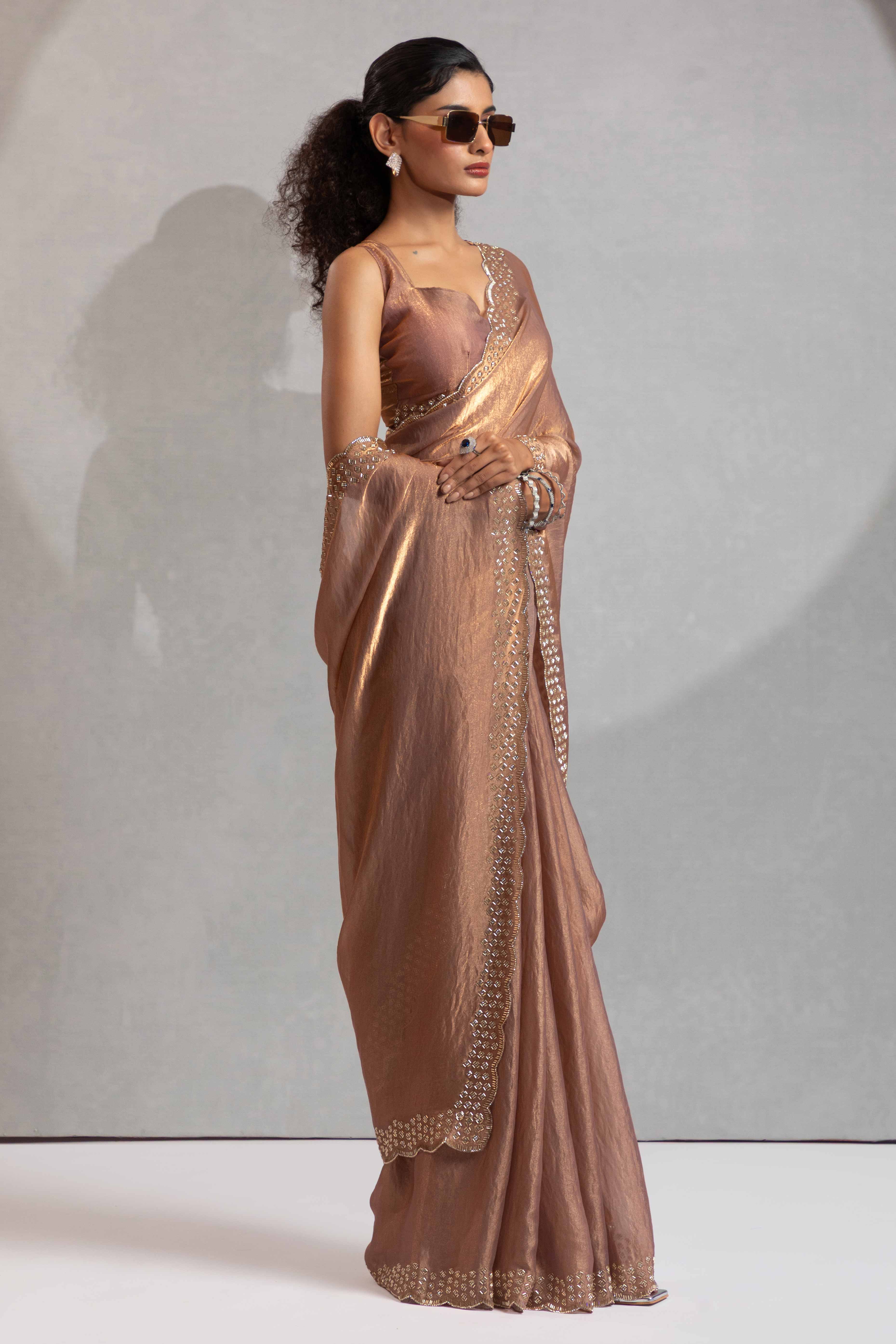 Shimmery Brown Satin Saree with Glamorous Stone Embellishment