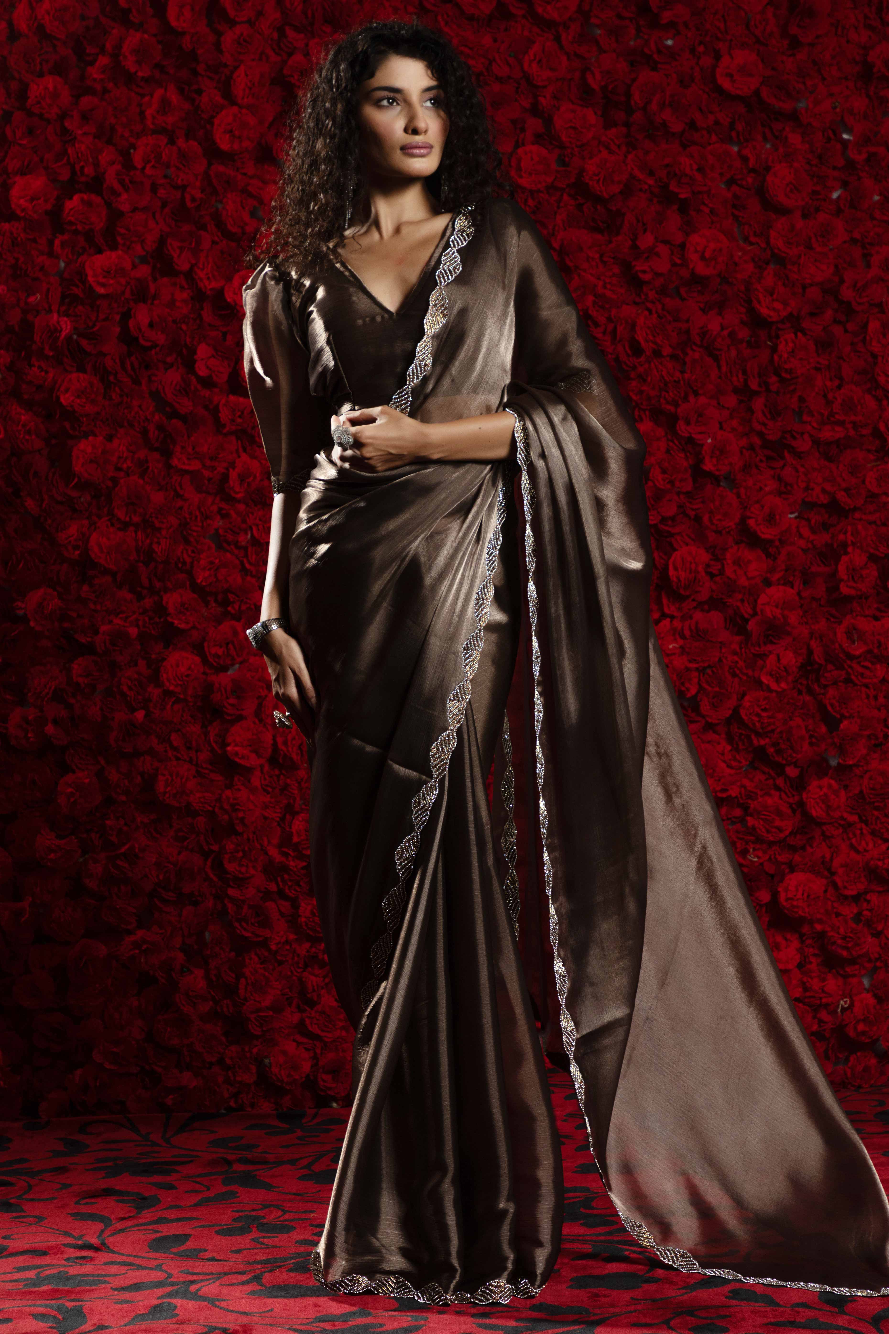 Dark Brown Solid Tissue Chiffon Saree Accentuated With A Sparkling Zarkan Work Border
