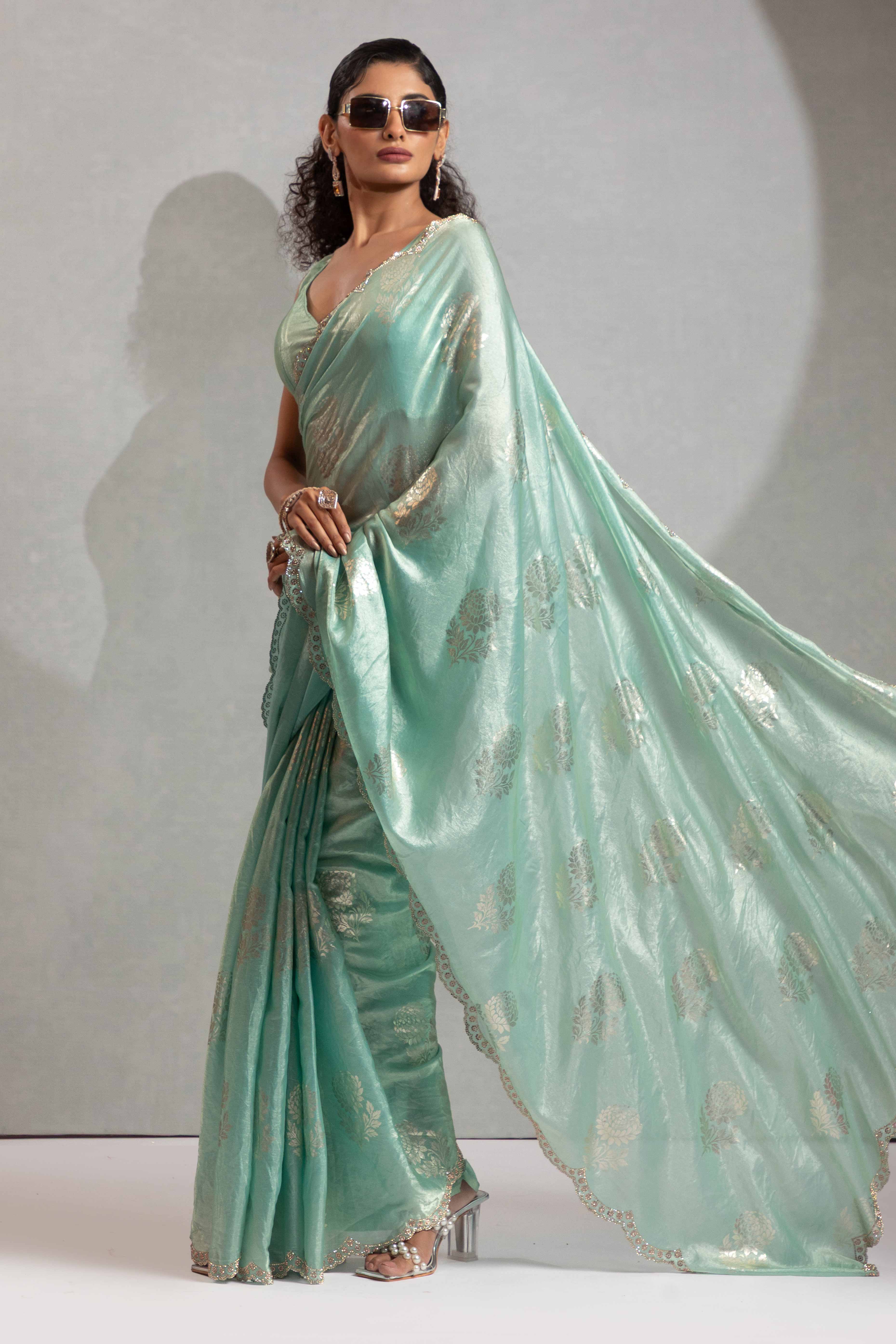 Turquoise Satin Silk Saree Showcasing Elegant Floral Foil Prints & Dazzling Zarkan Work