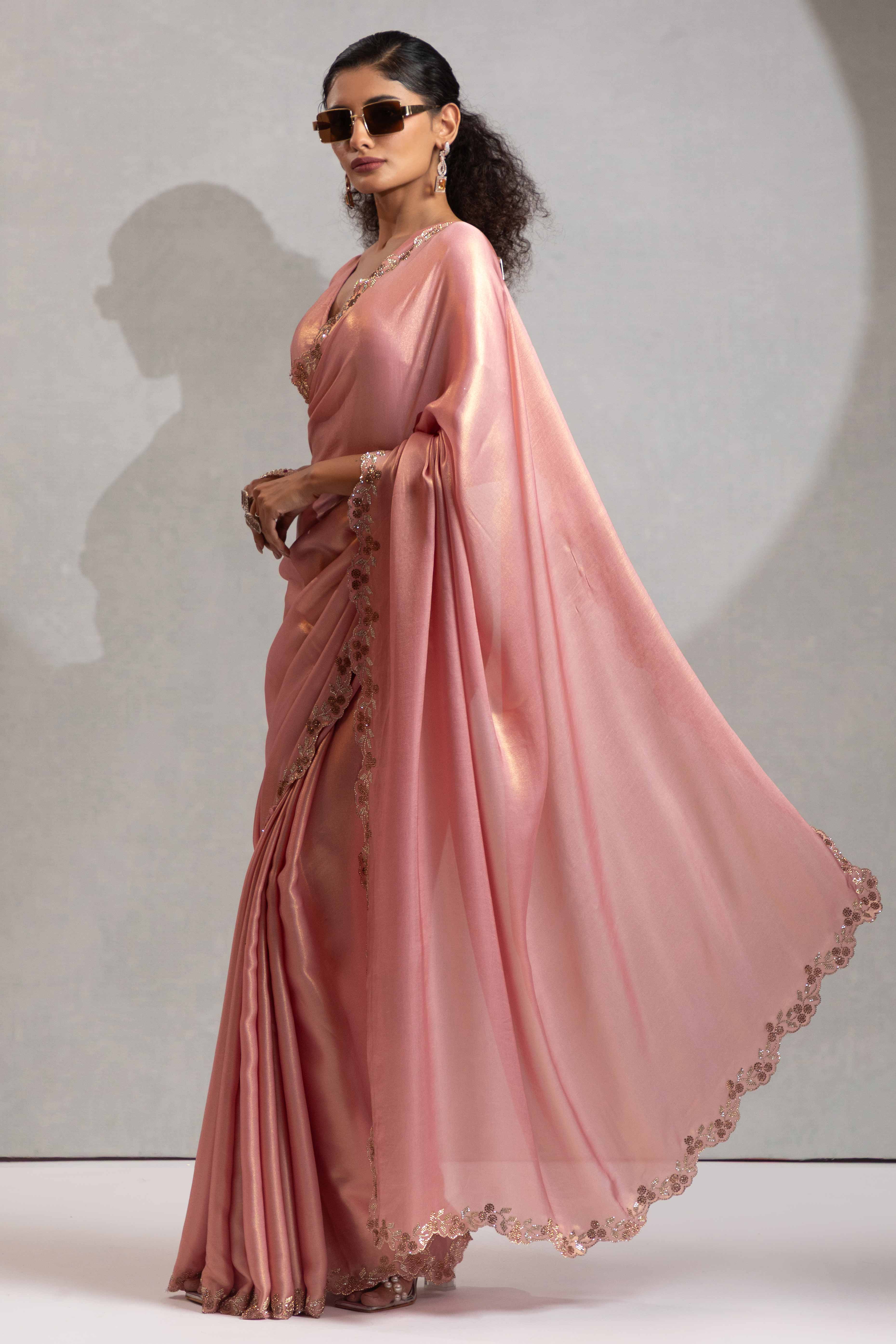 Peach Satin Georgette Saree Adorned With Subtle Foil Finish & A Sparkling Zarkan Work Border