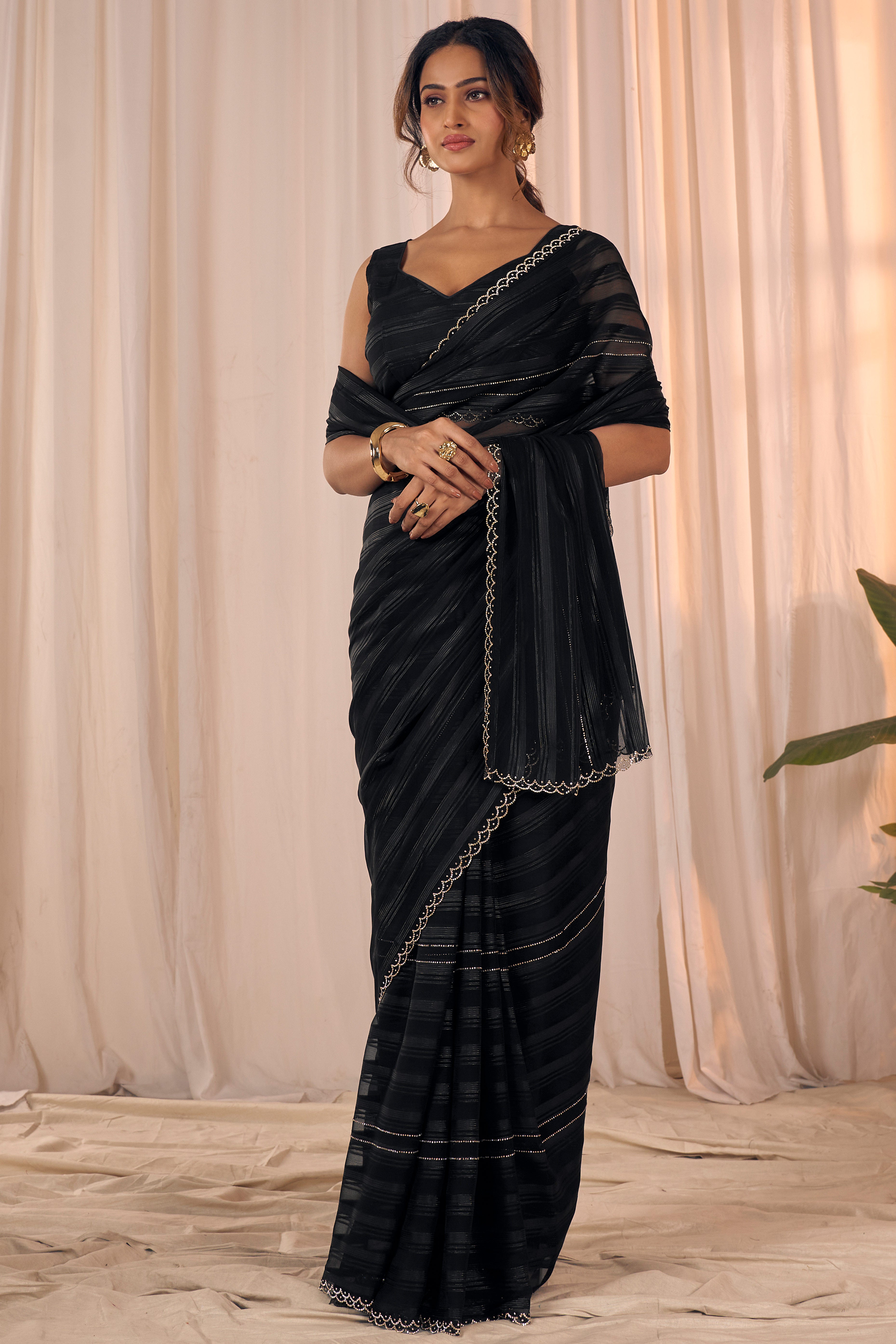 Black Striped Designer Georgette Saree Adorned With An Elegant Zarkan Cutwork Border