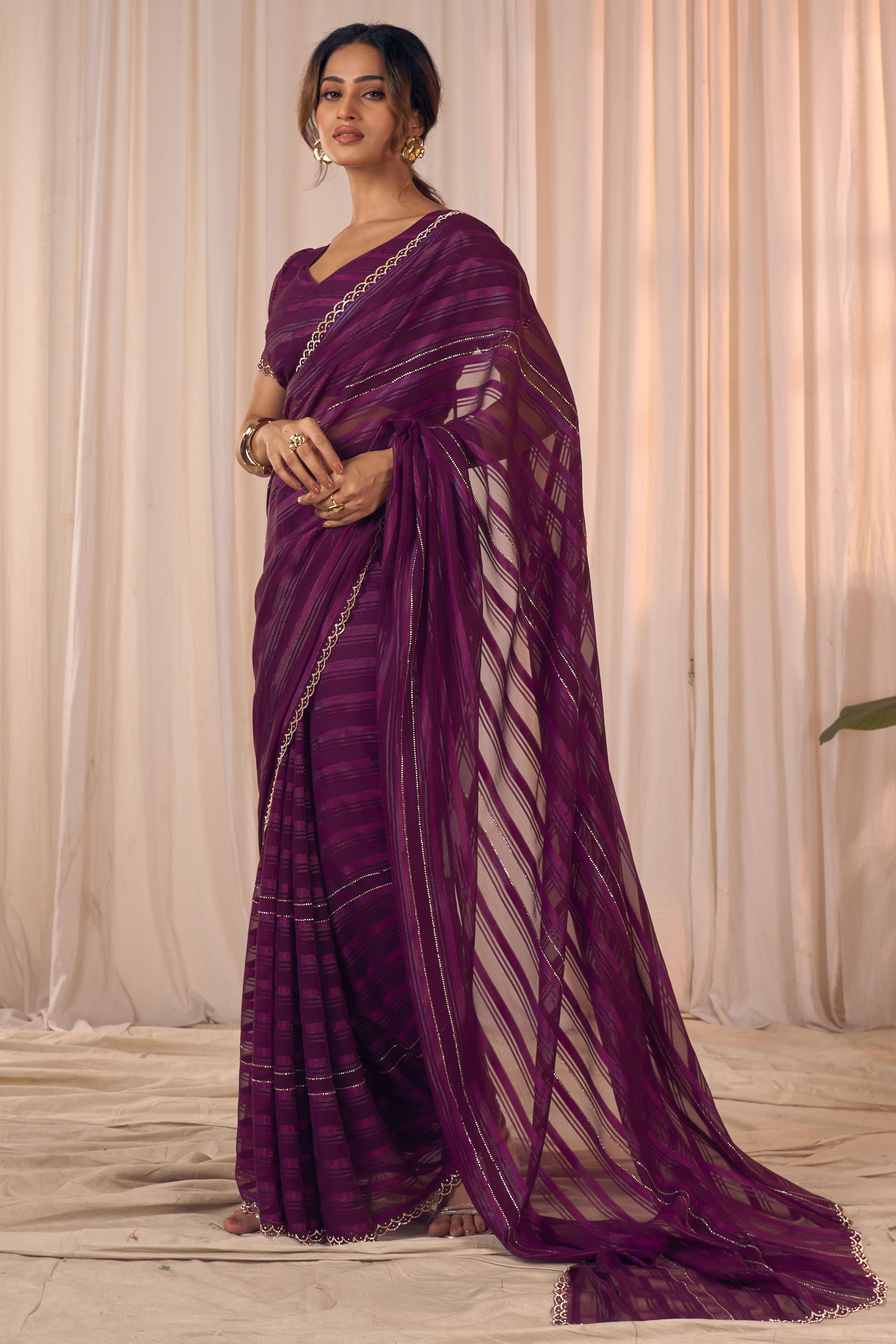 Wine Striped Designer Georgette Saree Adorned With An Elegant Zarkan Cutwork Border
