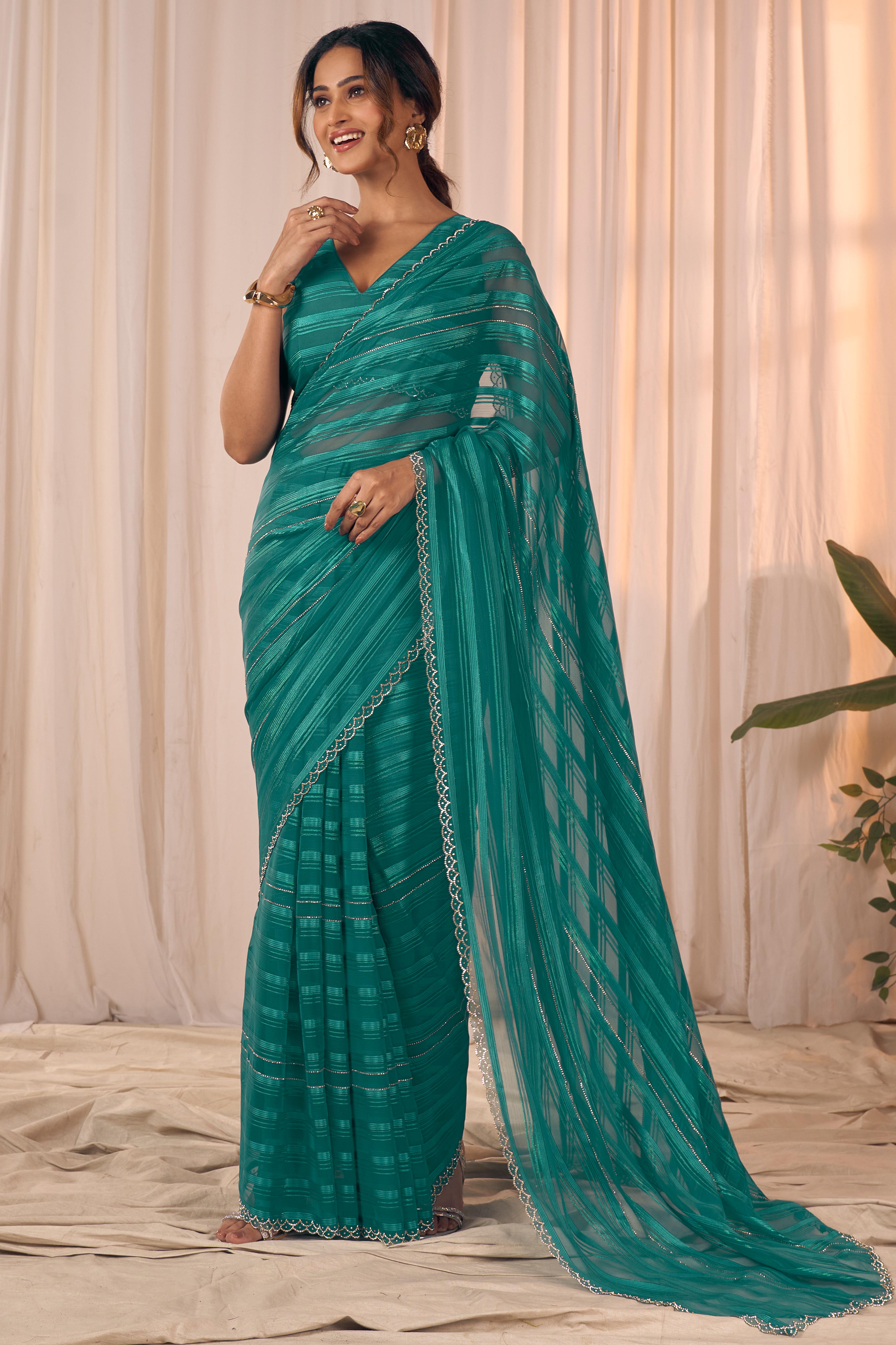 Teal Striped Designer Georgette Saree Adorned With An Elegant Zarkan Cutwork Border