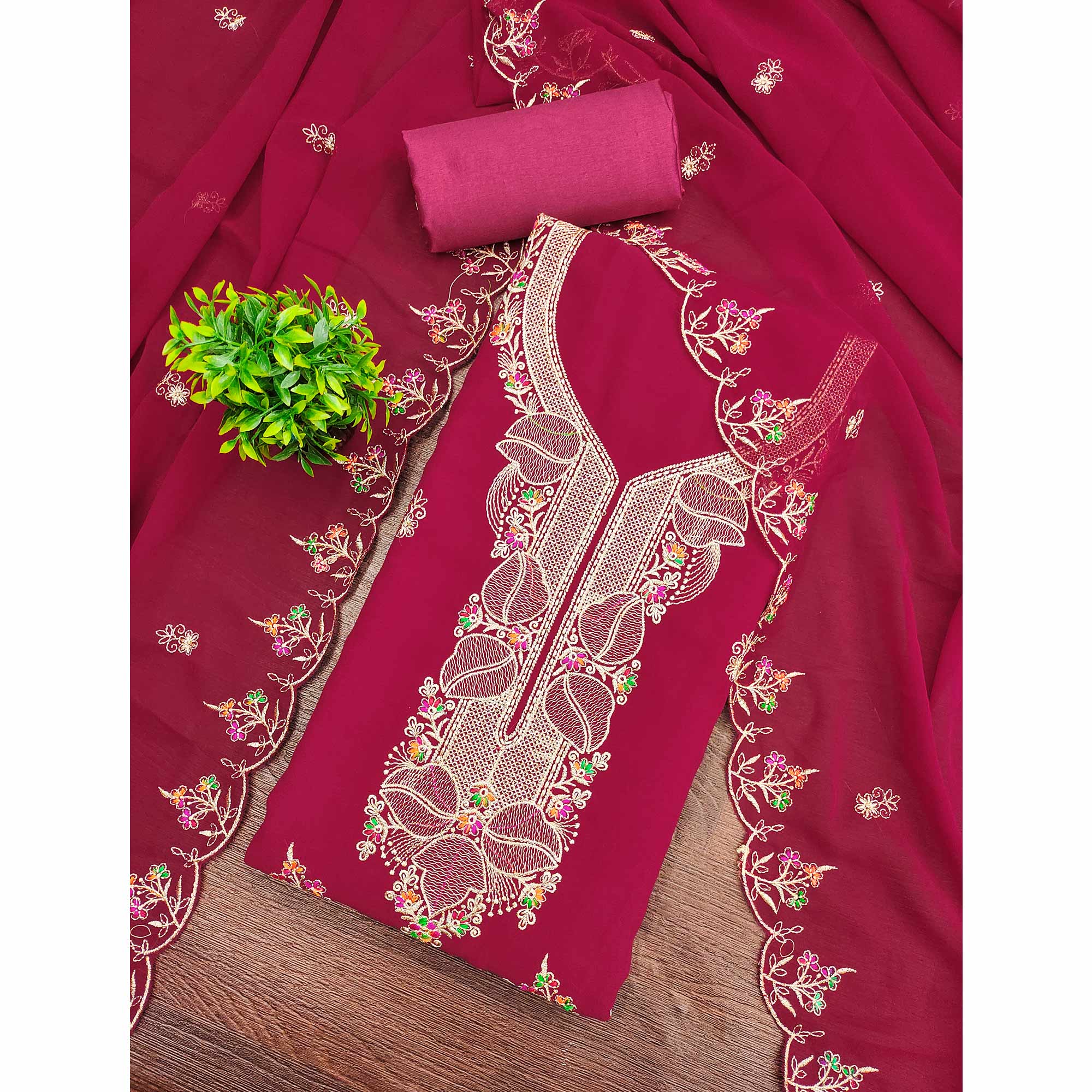 Rani Pink Georgette Dress Material Adorned With Floral Embroidery & Elegant Lace Border