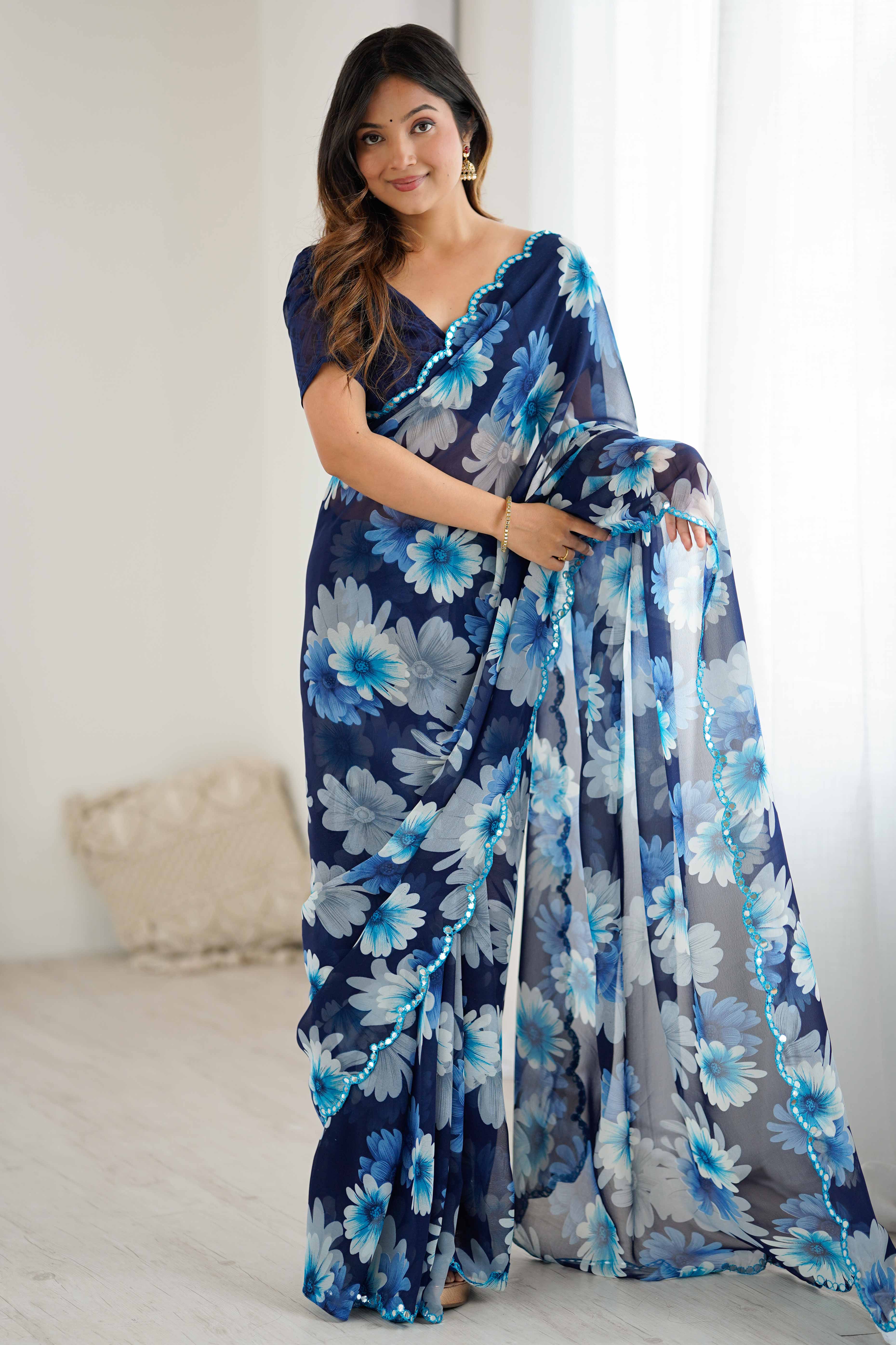 Blue Georgette Saree Featuring Floral Prints & Shimmering Mirror Work Border