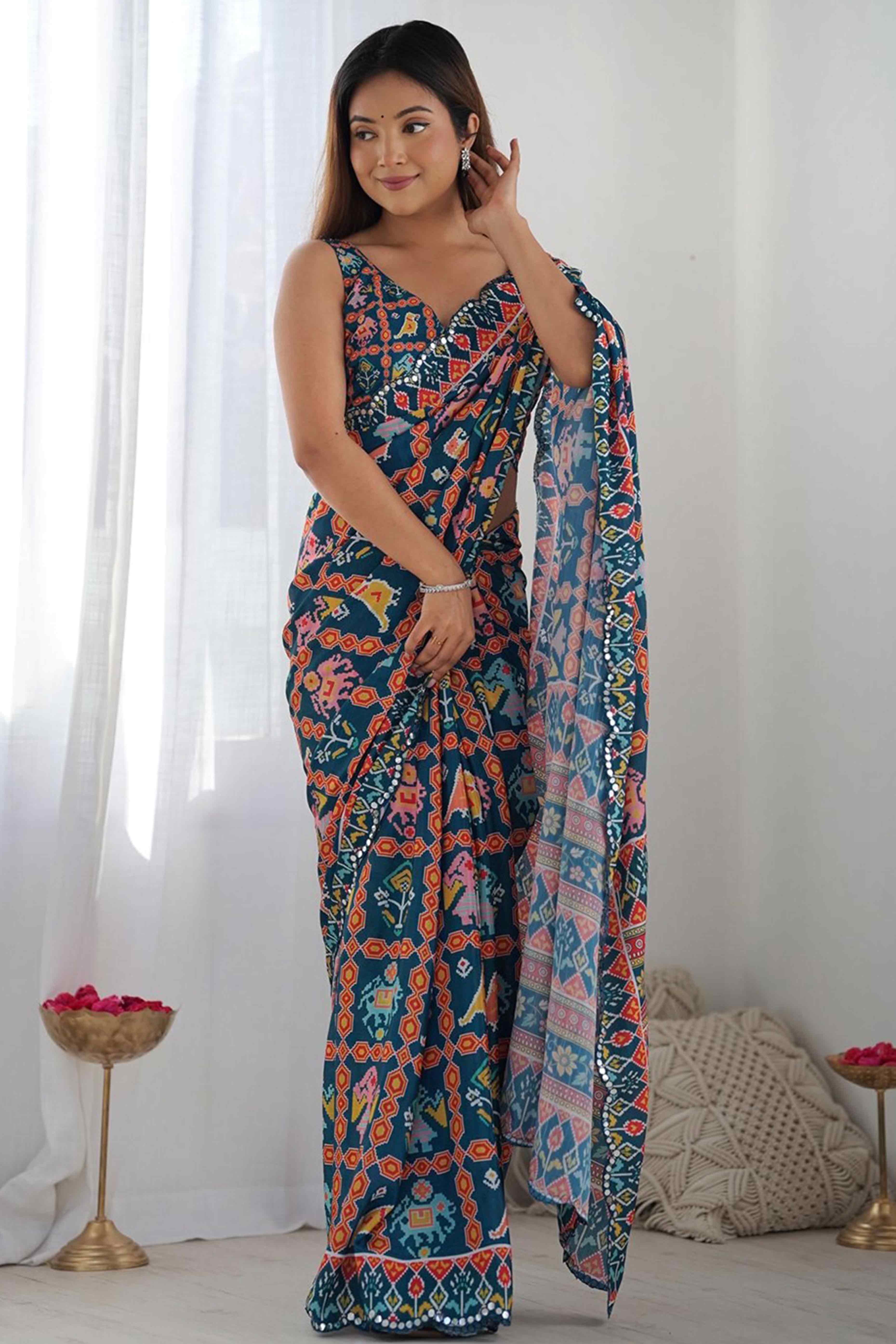 Dark Teal Blue Digital Print Georgette Saree Enhanced With A Sparkling Lace Border