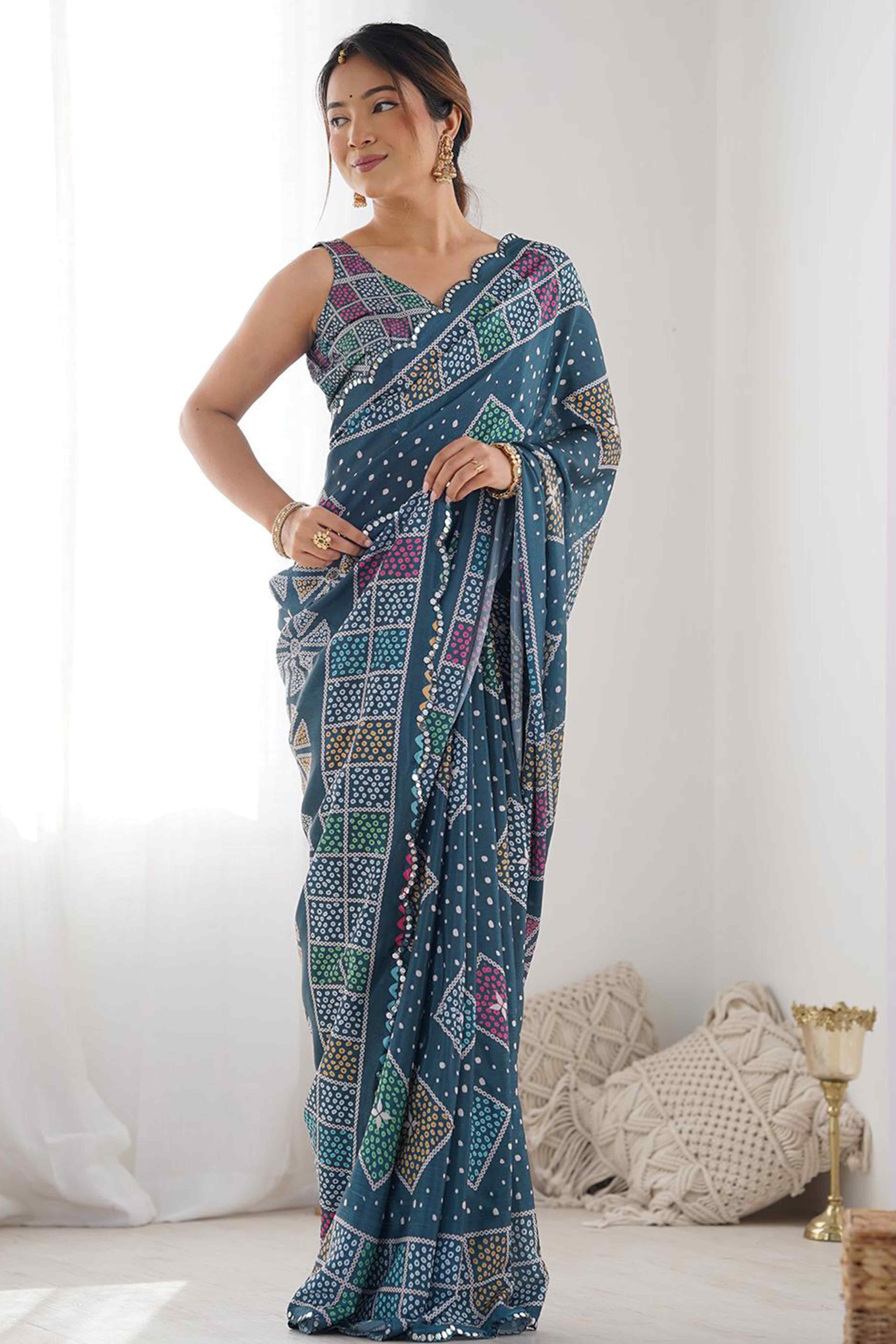 Morpich Blue Bandhani Digital Print Georgette Saree Enhanced With A Sparkling Lace Border