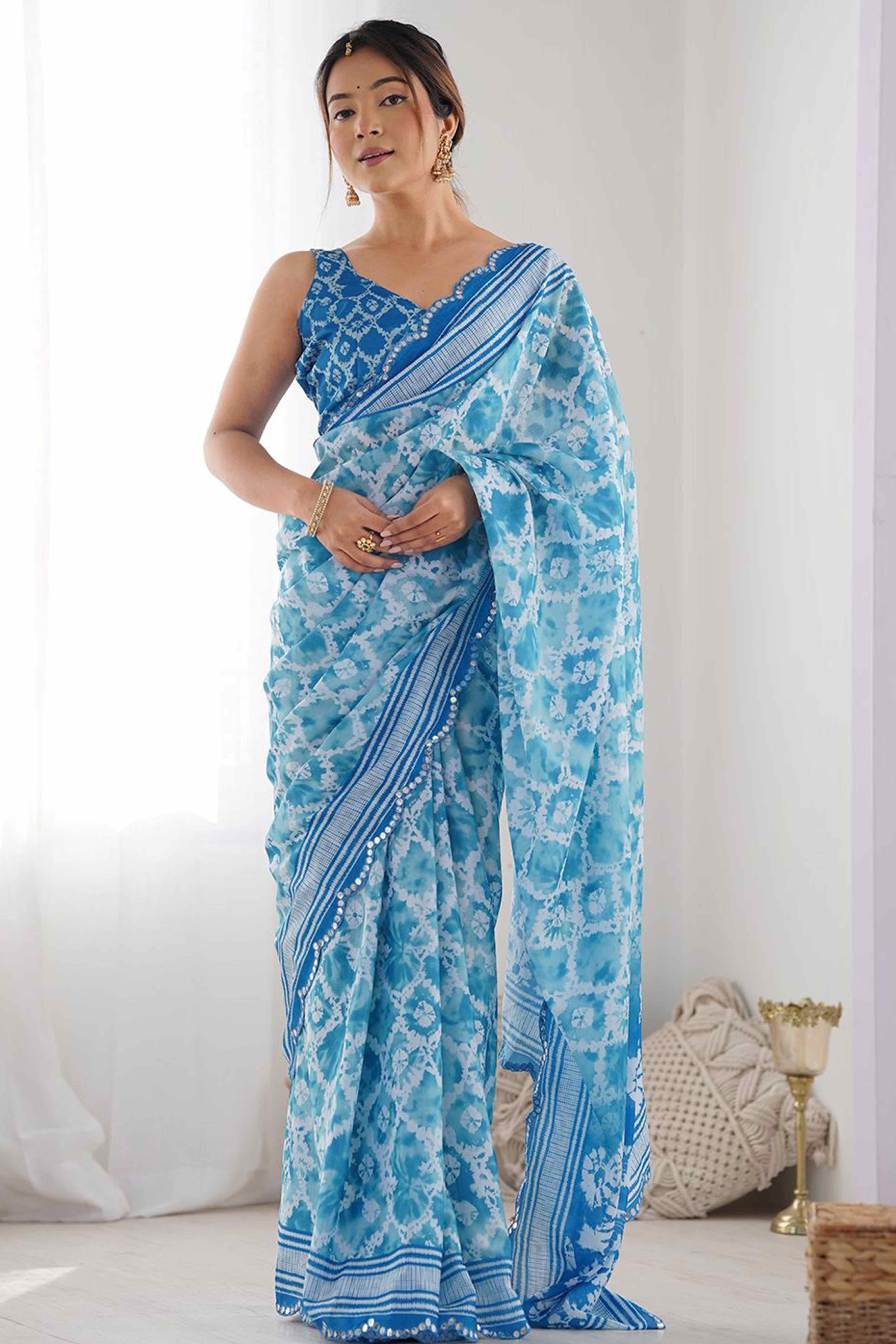 Sky Blue Digital Print Georgette Saree Enhanced With A Sparkling Lace Border