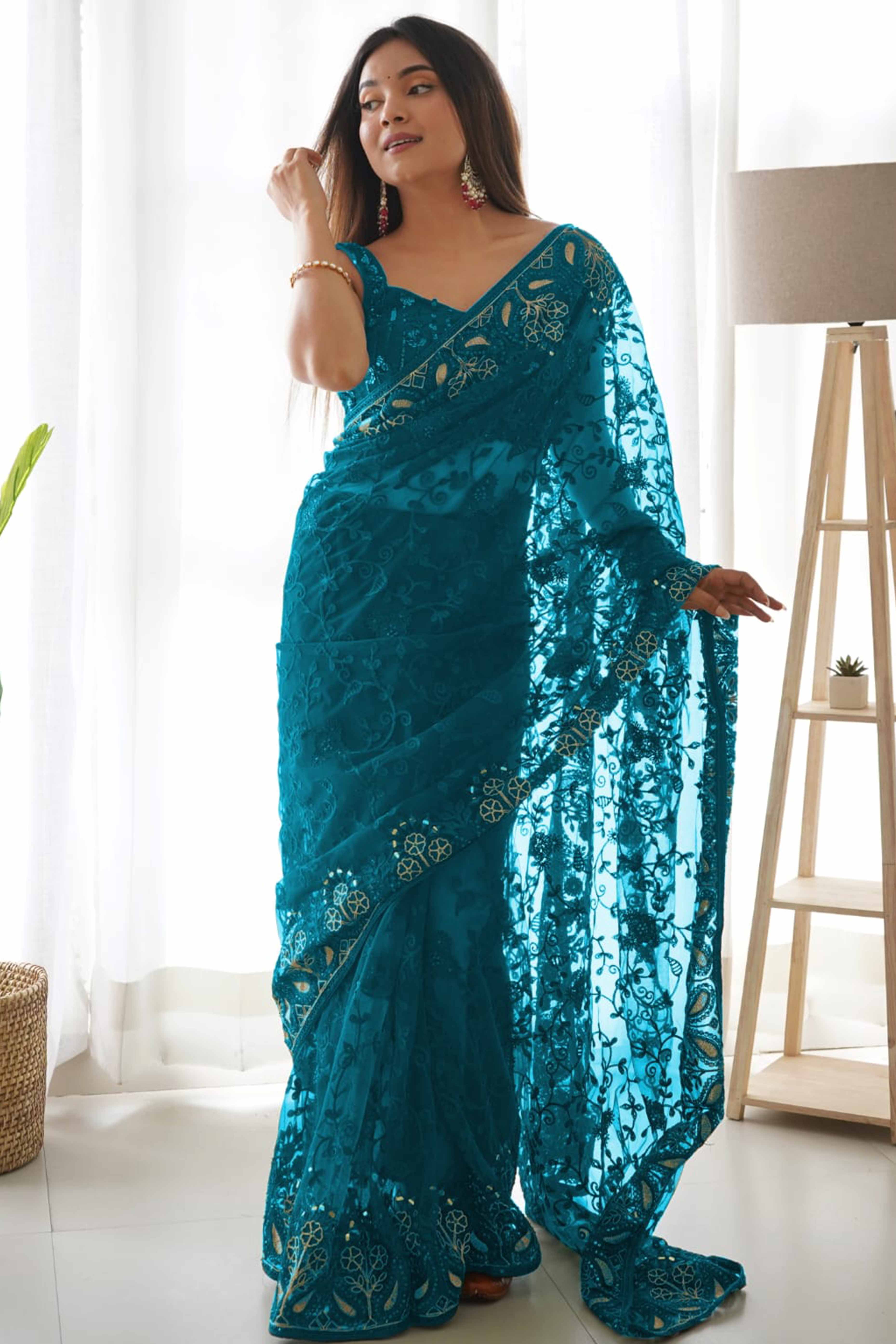 Teal Net Saree With Floral Thread Embroidery Adorned In Stone & Mirror Accents