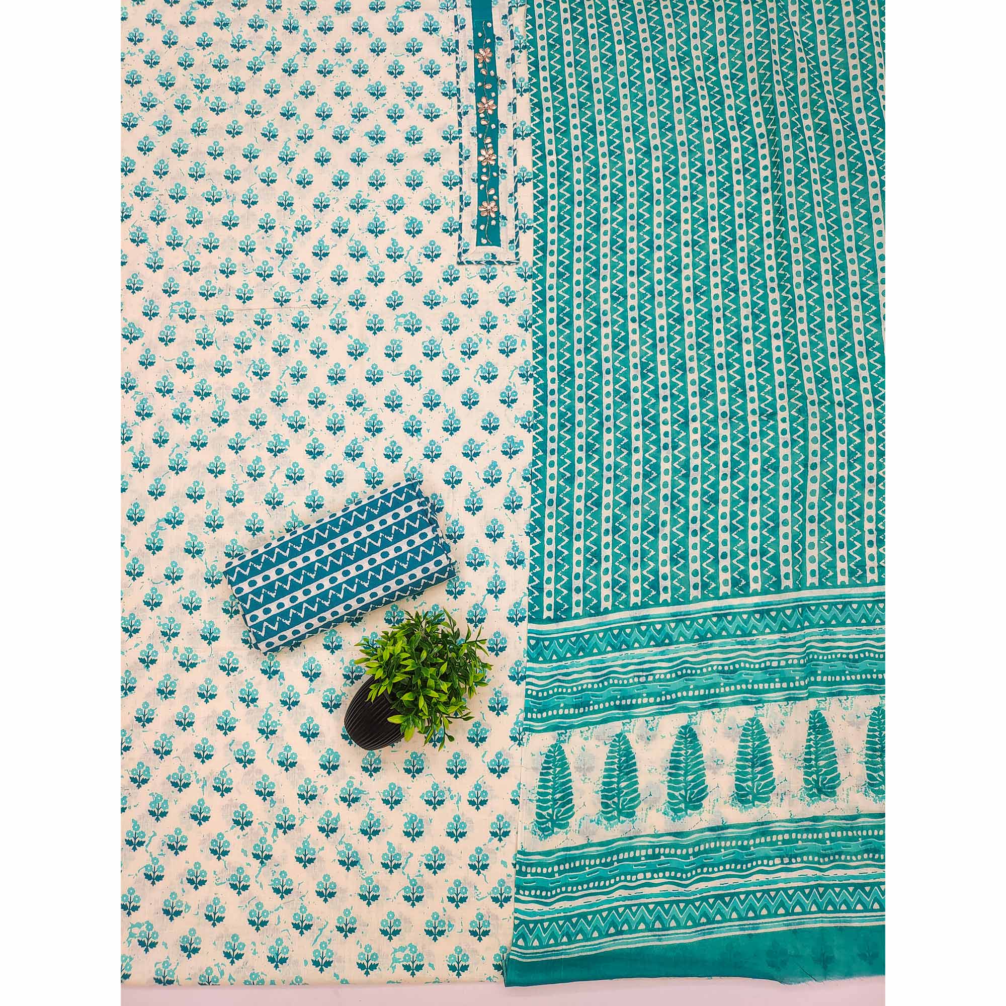 Turquoise Cotton Suit Material Enhanced with Soft Floral Prints