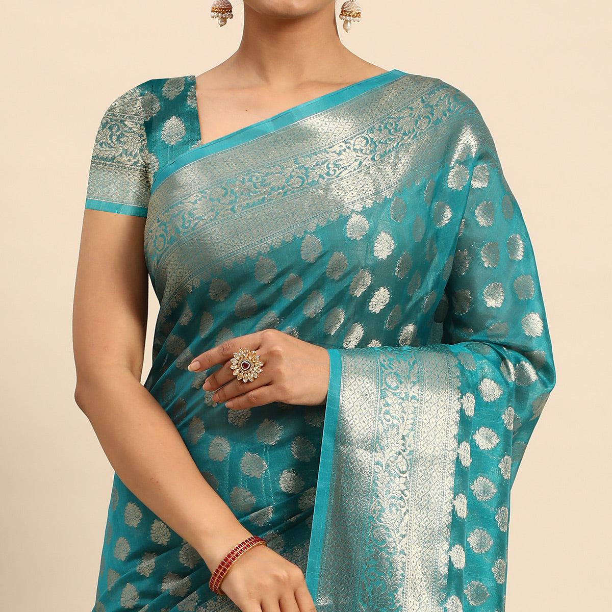 Turquoise Woven Organza Silk Saree With Tassels