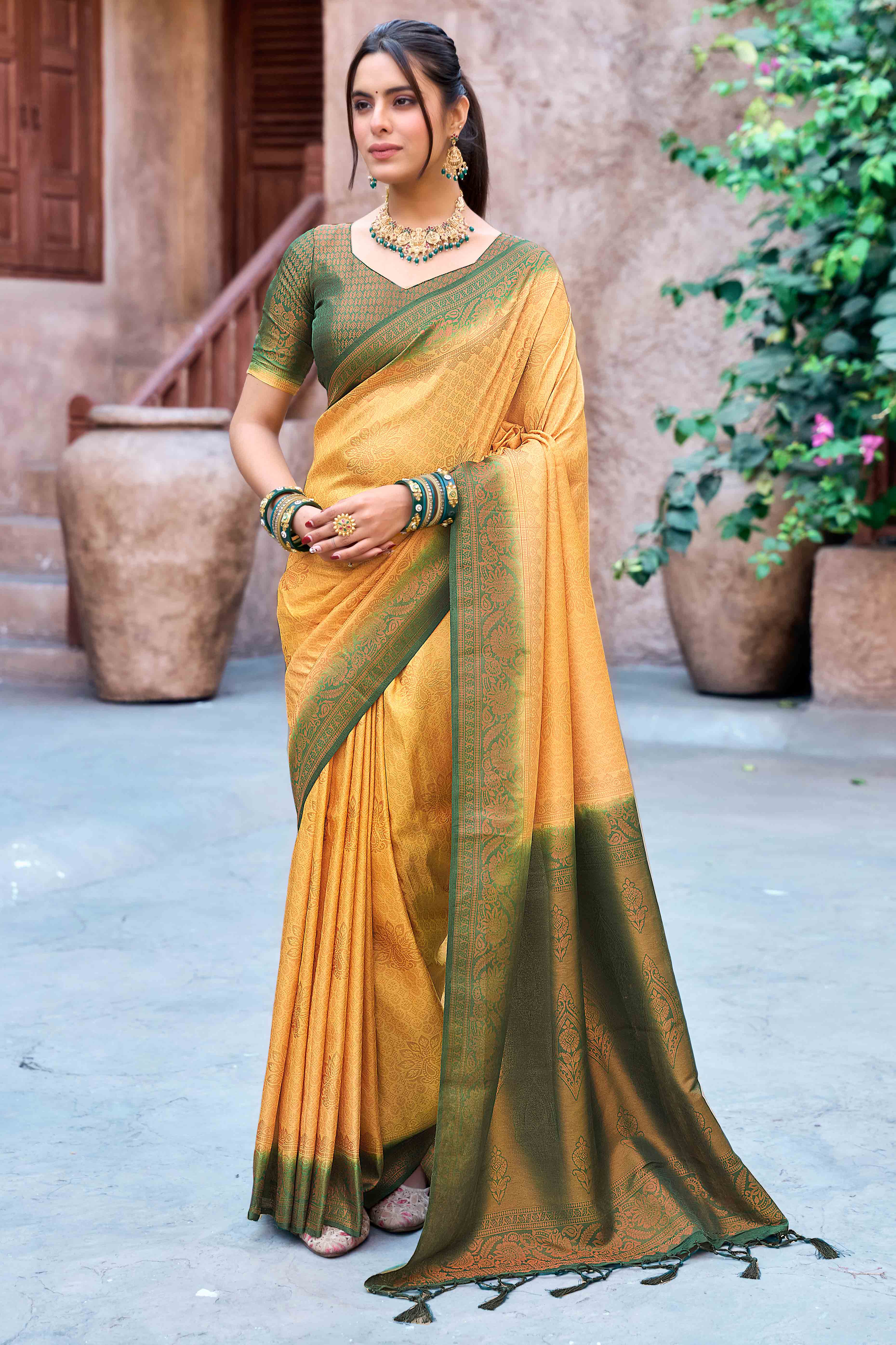 Mustard Banarasi Silk Saree Featuring Elegant Floral Woven & Delicate Tassel Edging