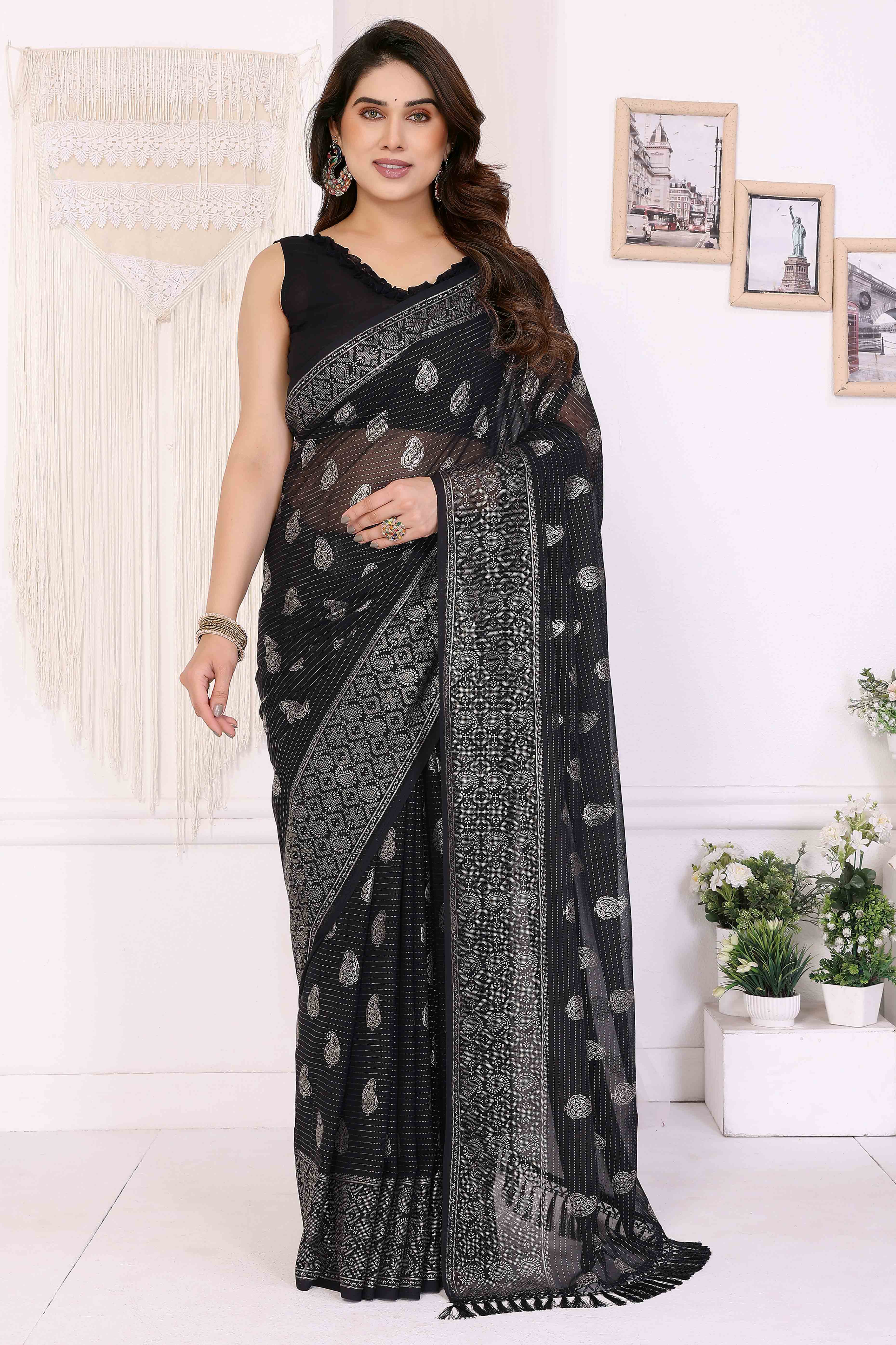 Black Foil Printed Georgette Saree Enhanced With Delicate Lace Border & Elegant Tassel