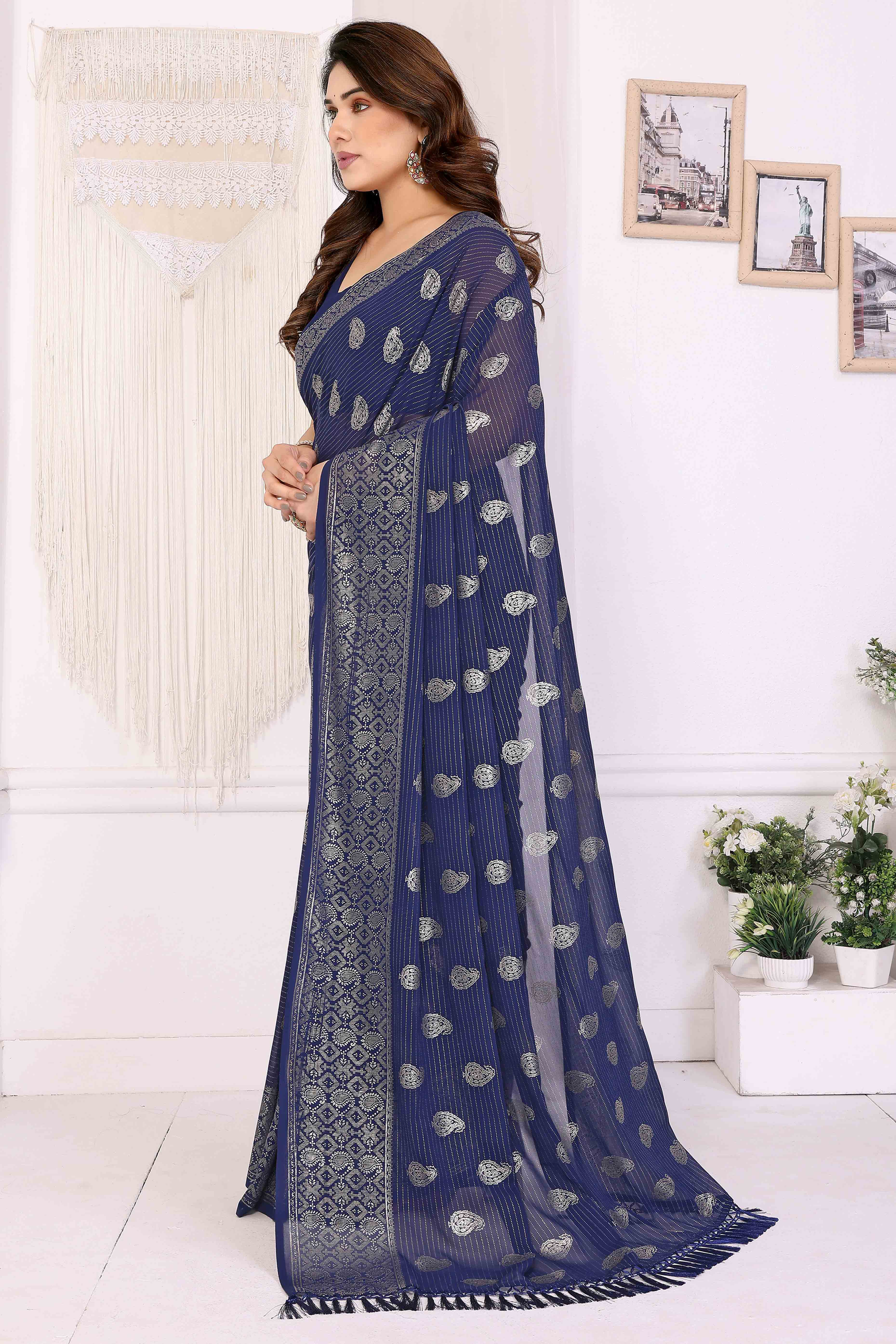 Blue Foil Printed Georgette Saree Enhanced With Delicate Lace Border & Elegant Tassel