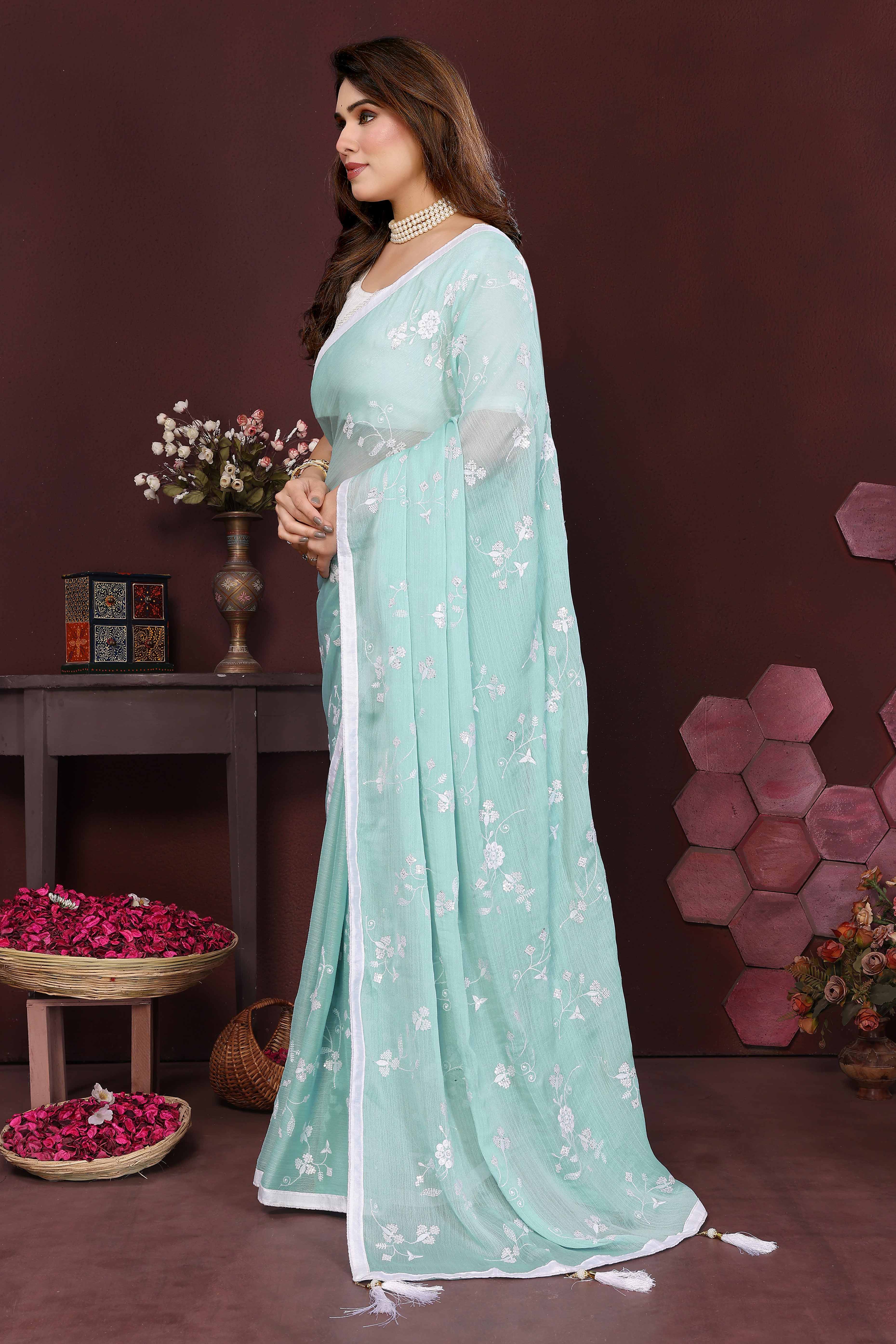 Pale Turquoise Bloom Saree adorned with Moss Floral Embroidery and Delicate Lace Border
