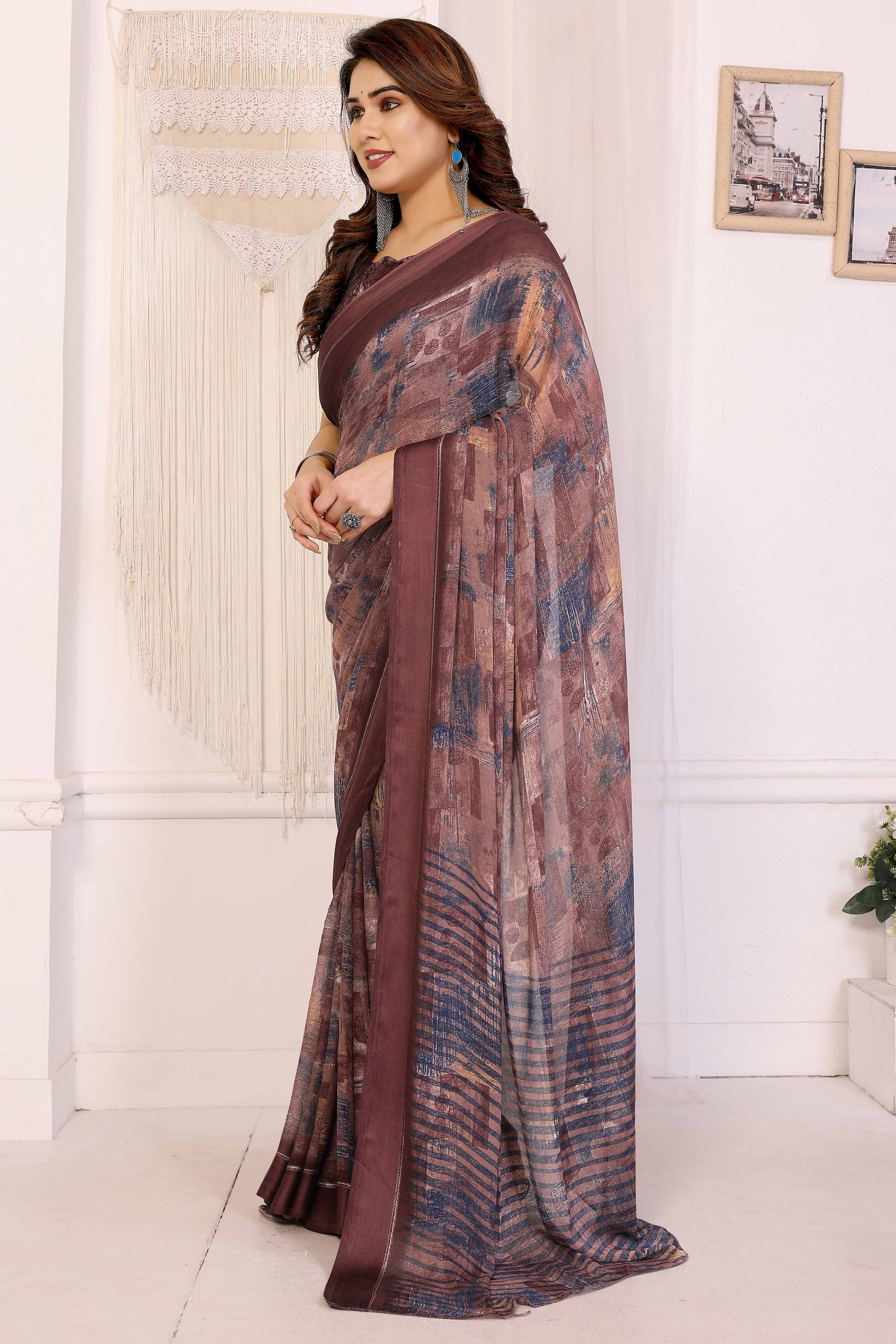 Trendy Brown Moss Crepe Saree with Floral Motifs and Satin Border