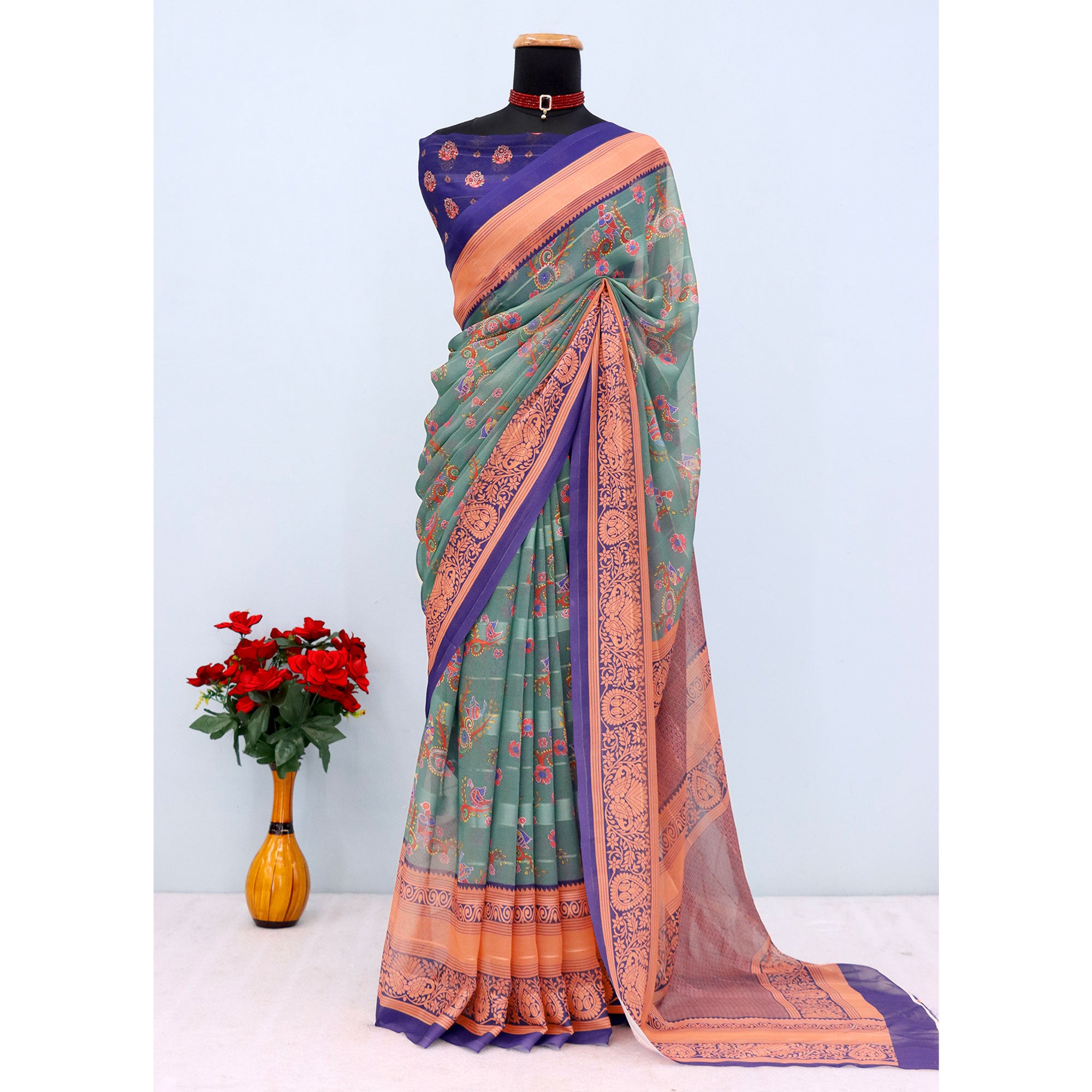 Elegant Rama Green & Blue Floral Digital Printed Georgette Saree Adorned With Subtle Zari Stripes