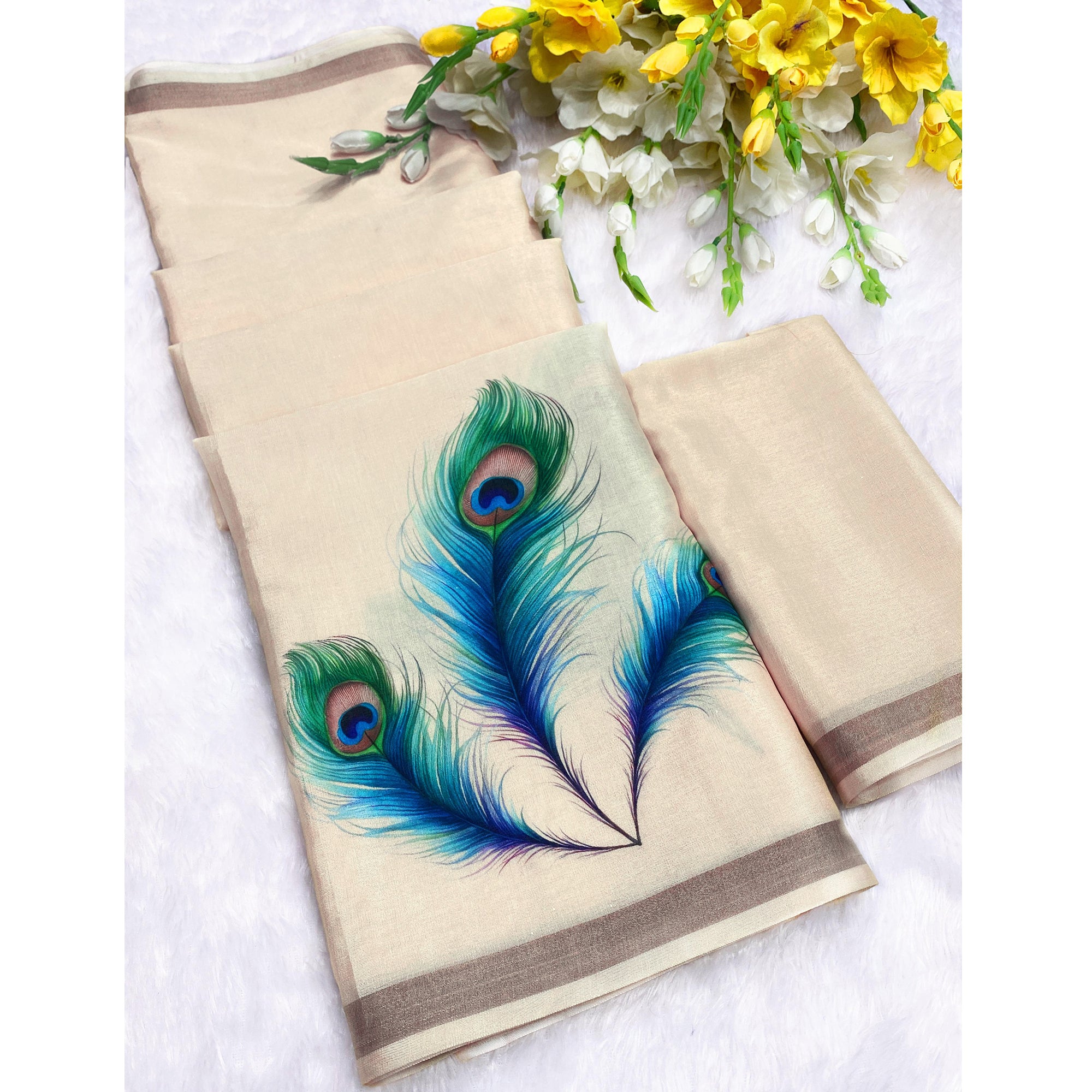 Charming Cream Soft Tussar Cotton Silk Saree With Peacock Feathers Print