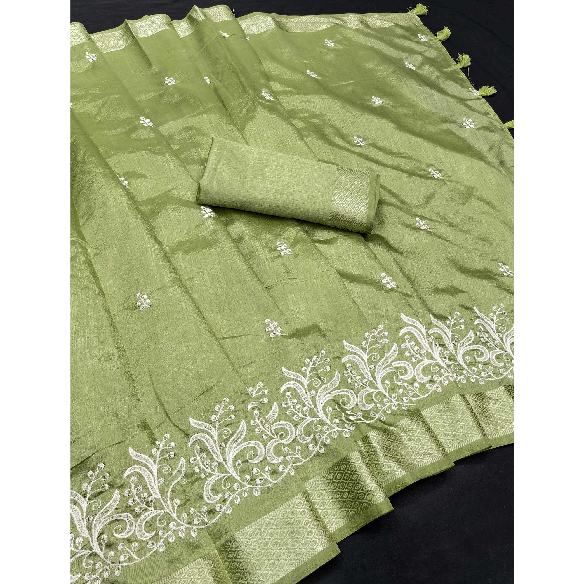 Green Art Silk Saree Adorned With Delicate Floral Embroidery & Stylish Tassel Pallu