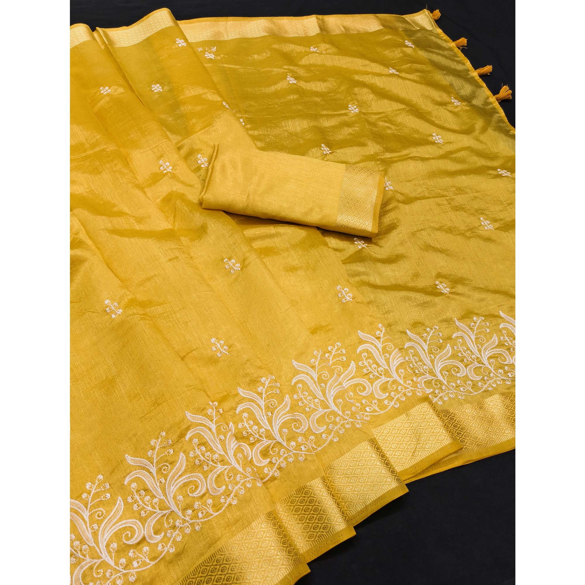 Mustard Art Silk Saree Adorned With Delicate Floral Embroidery & Stylish Tassel Pallu