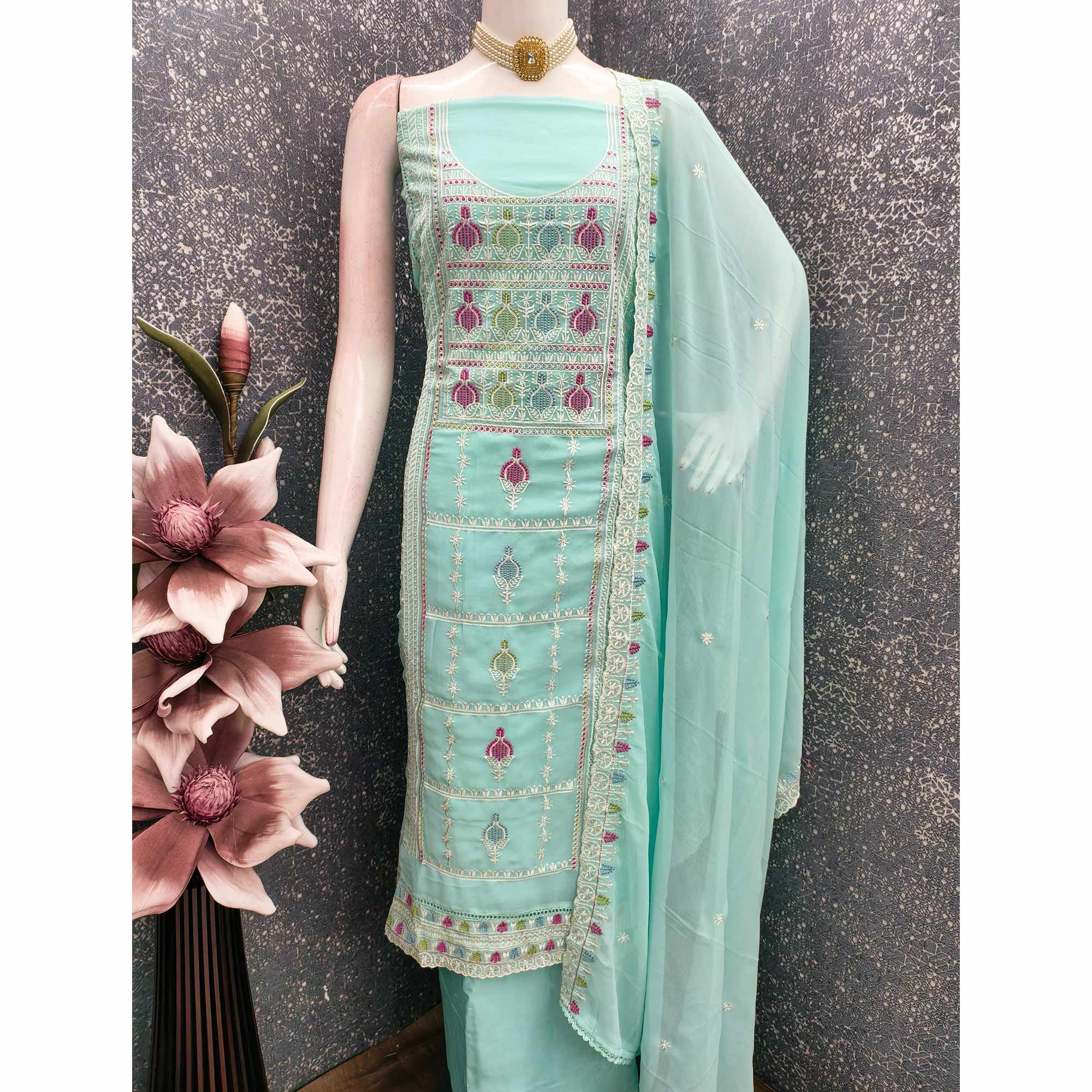 Sophisticated Turquoise Georgette Dress Material Accented With Ornate Floral Thread Embroidery