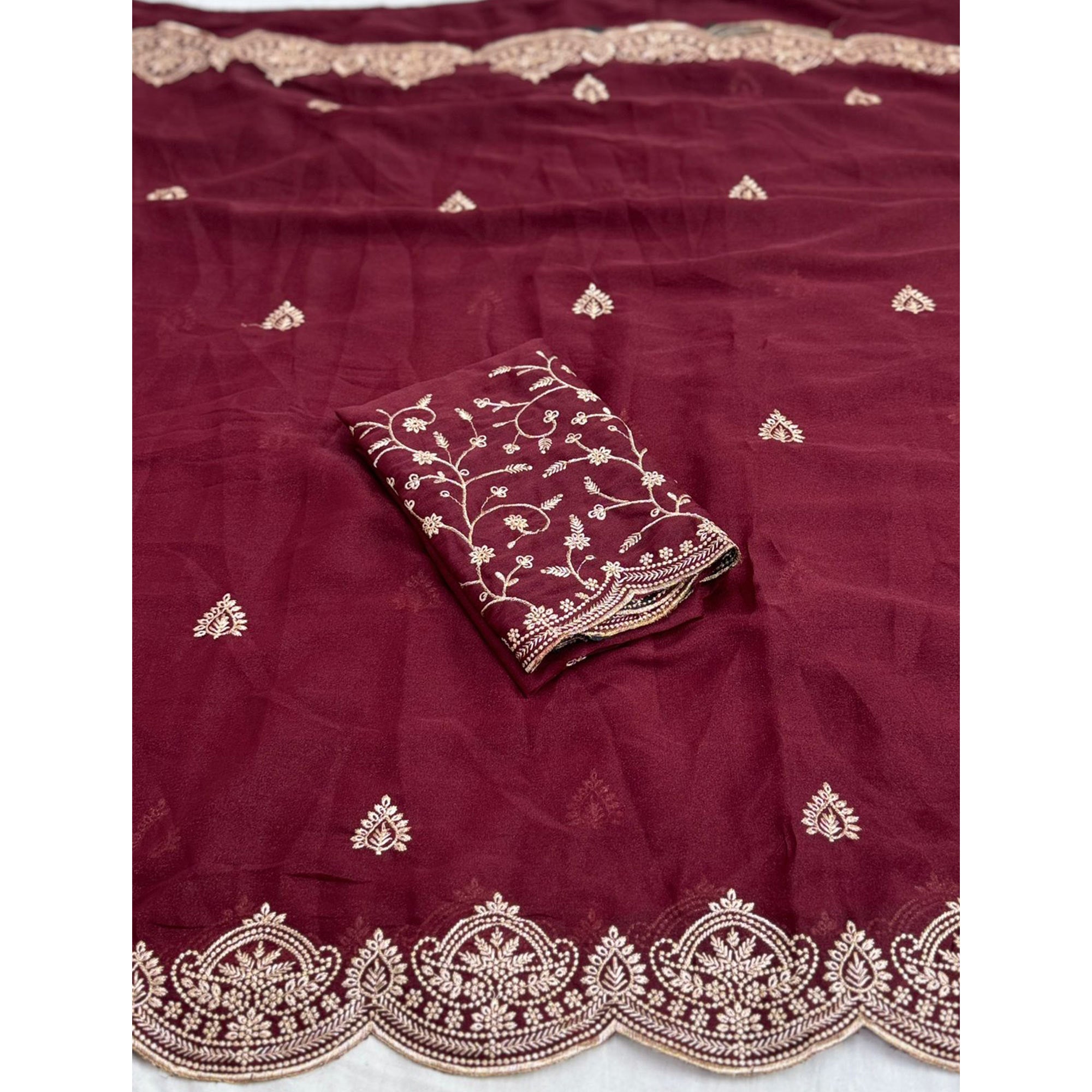 Gorgeous Maroon Floral Embroidered Georgette Saree Accented With Luxurious Zari Work