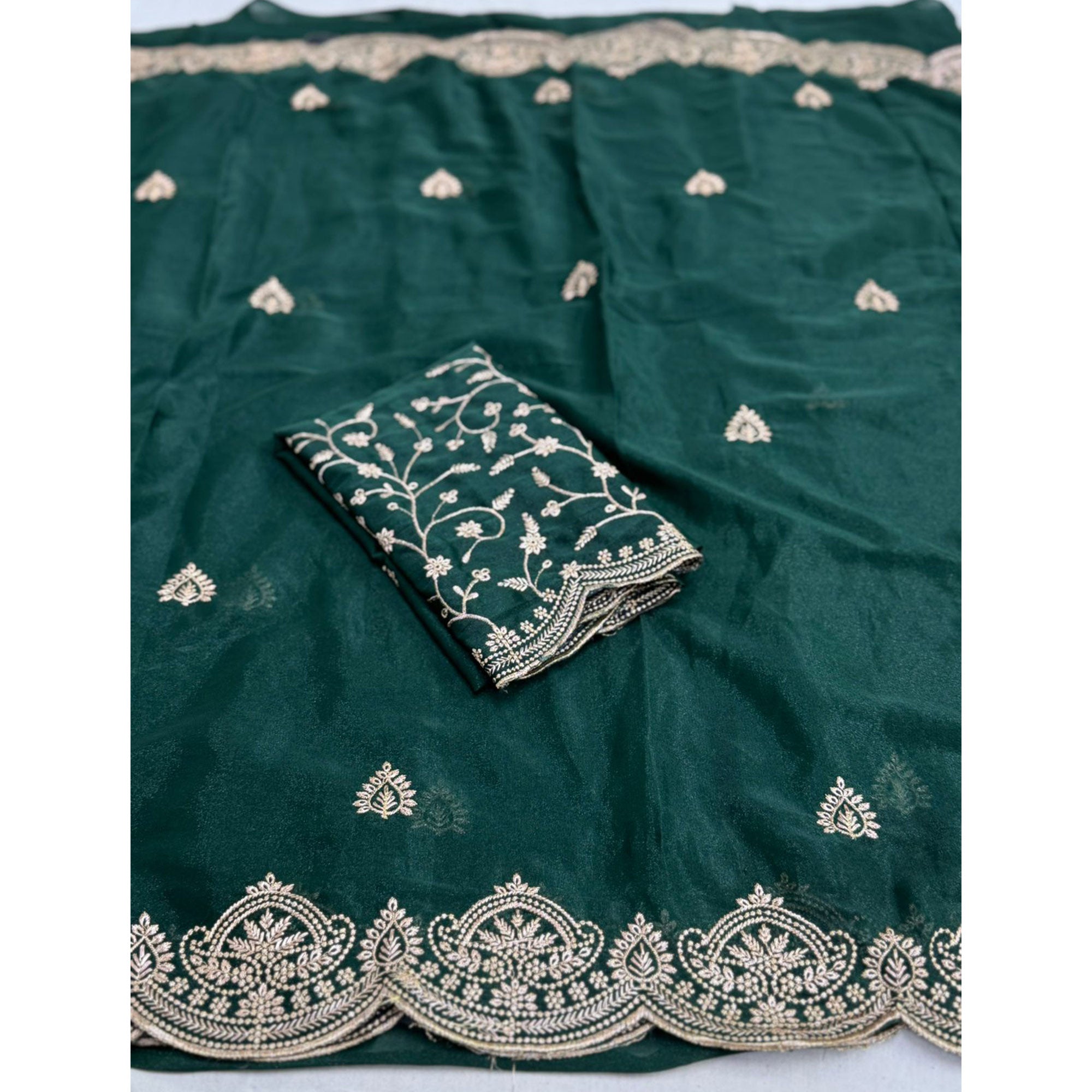 Gorgeous Teal Green Floral Embroidered Georgette Saree Accented With Luxurious Zari Work