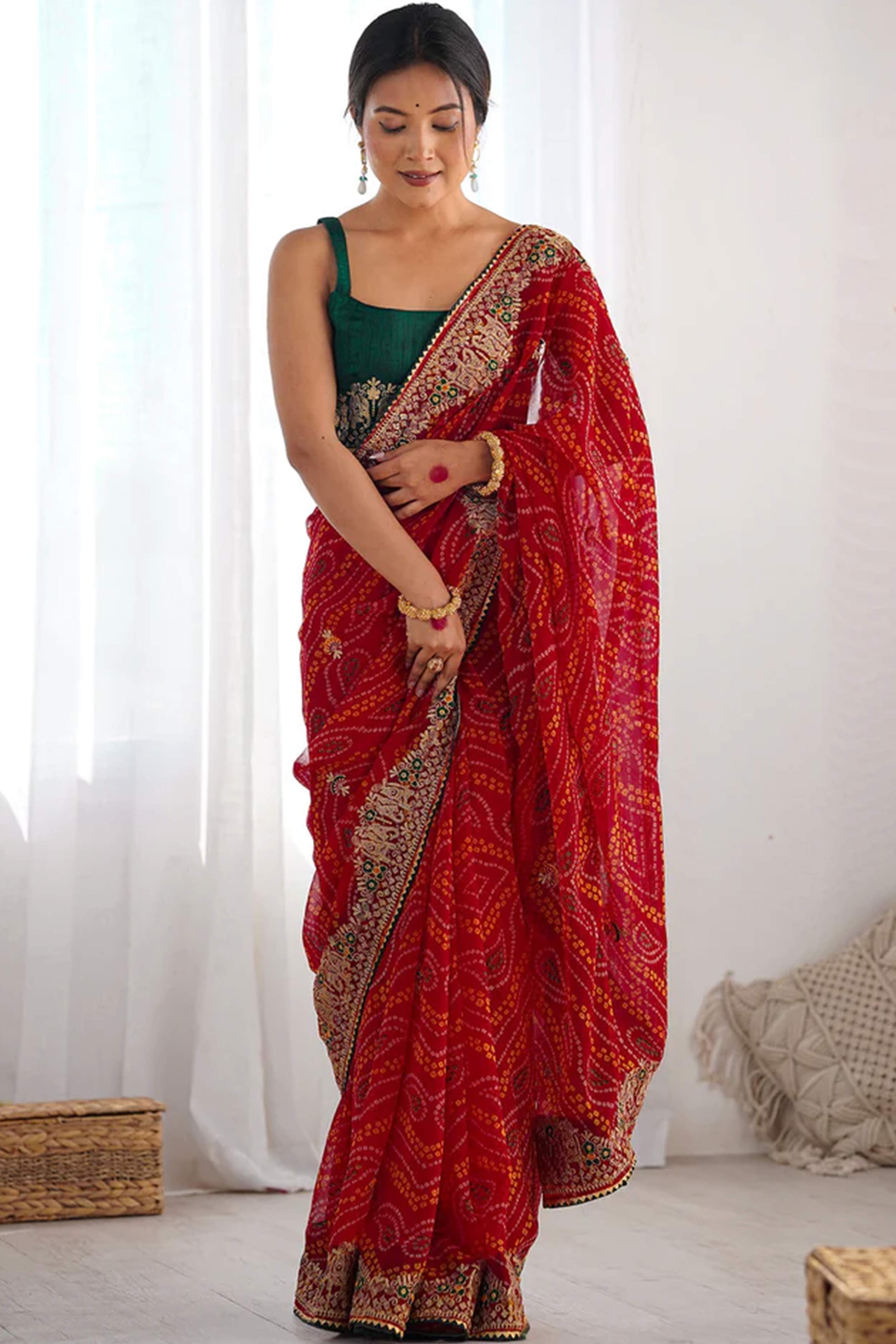 Classic Red Bandhani Print Georgette Saree Enhanced With Intricate Zari Embroidered Border Detailing