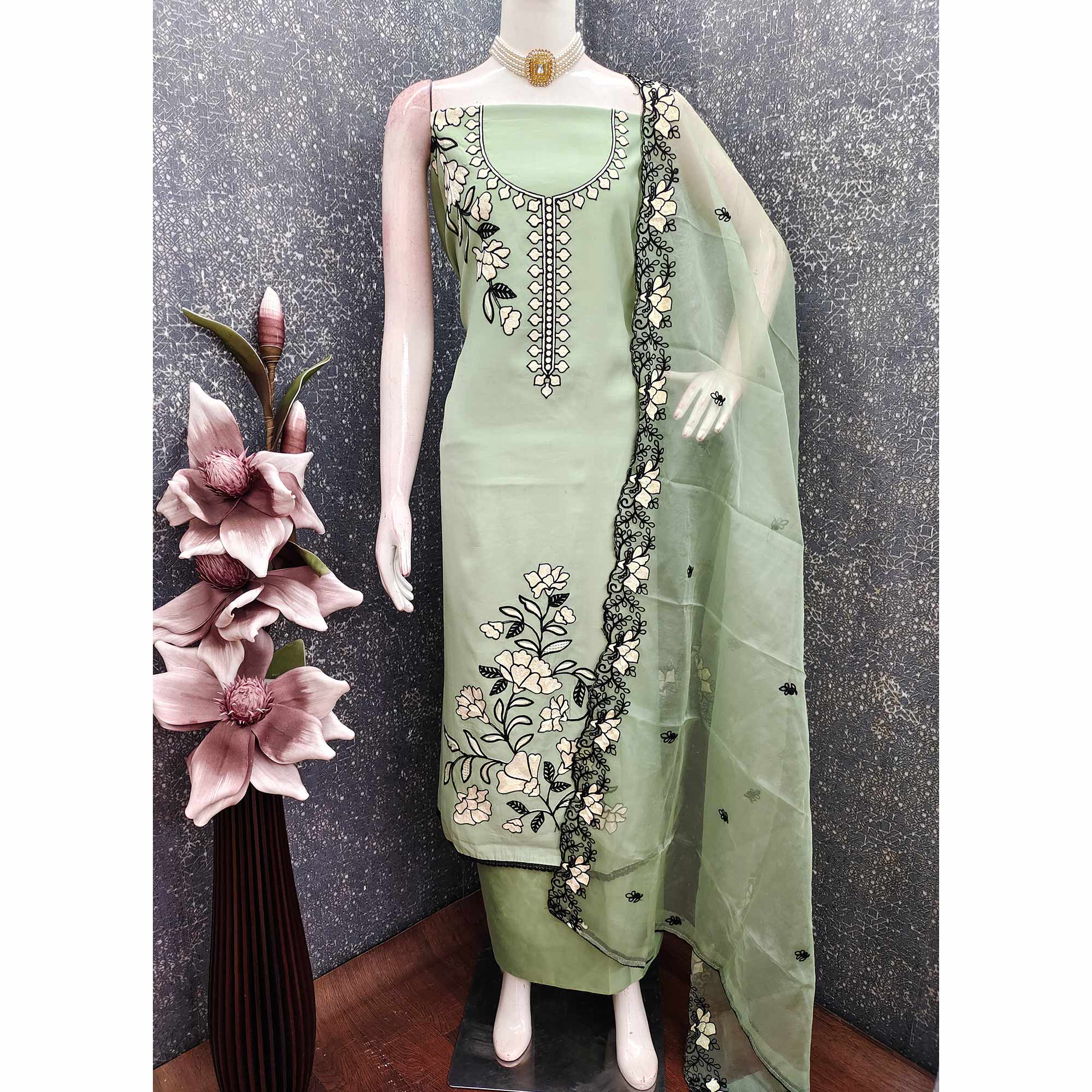 Graceful Green Floral Viscose Dress Material Enhanced With Intricate Thread Embroidery Work