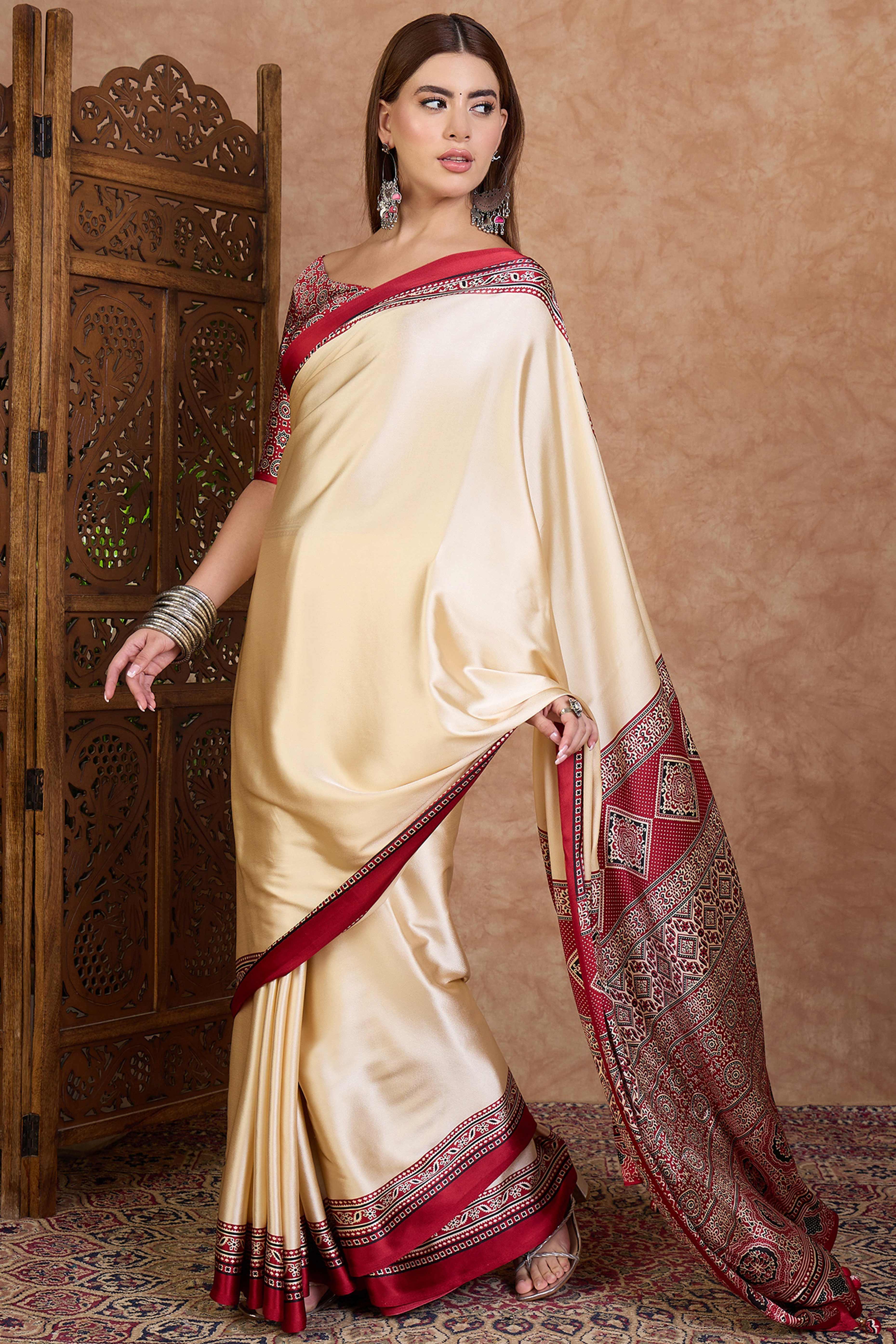 Cream & Red Modal Satin Saree Featuring a Solid Base and Artisanal Ajrakh Pallu