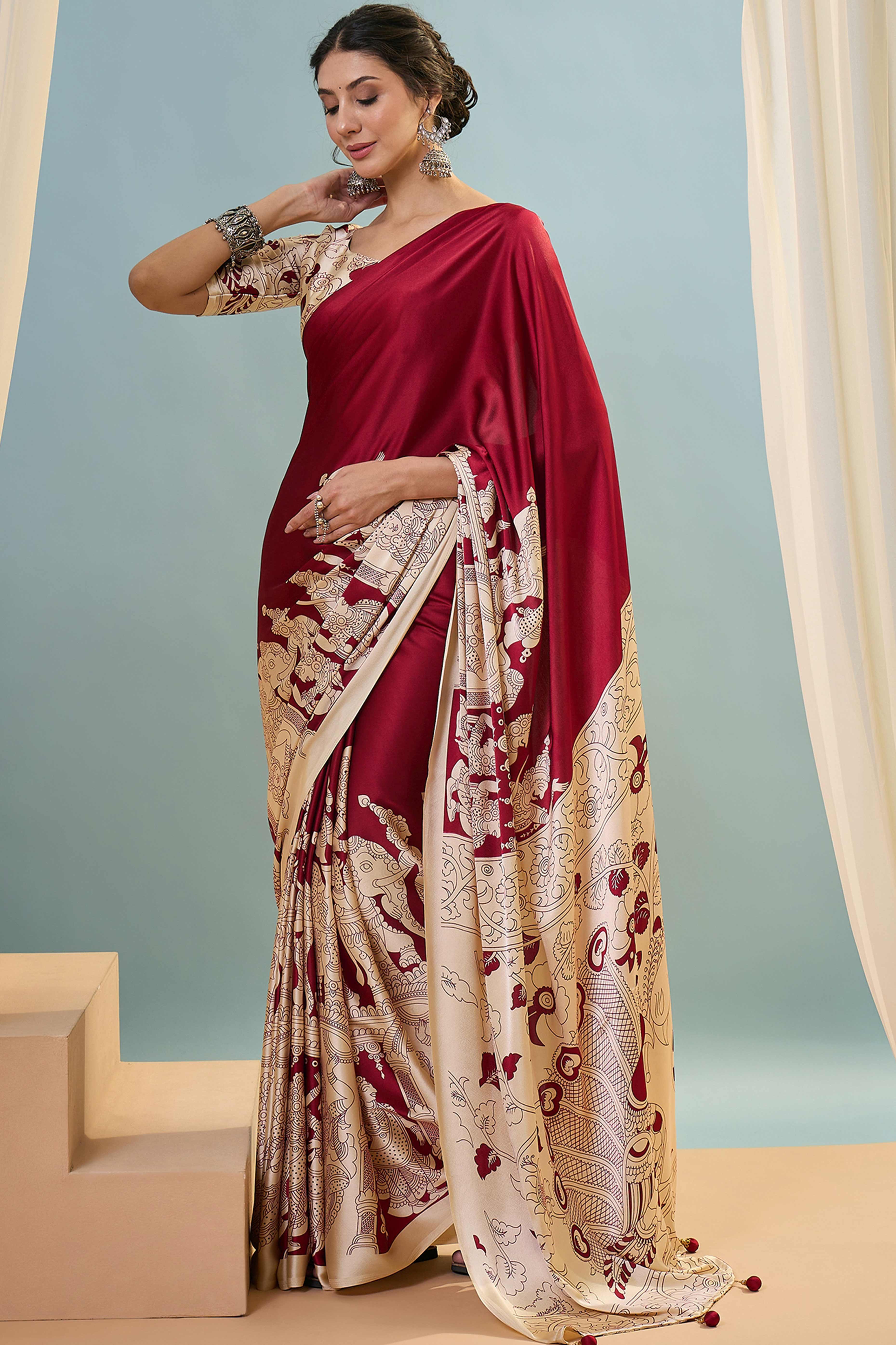 Red Kalamkari Style Modal Satin Saree Featuring Intricate Artistic Prints