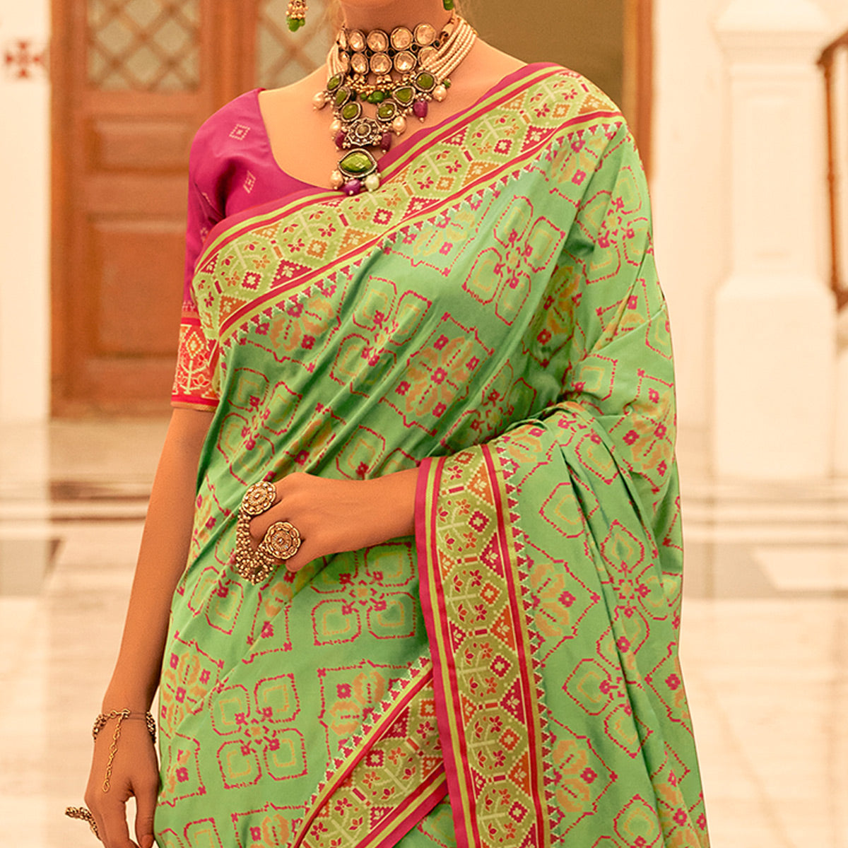 Green Patola Printed Banarasi Silk Saree With Tassels